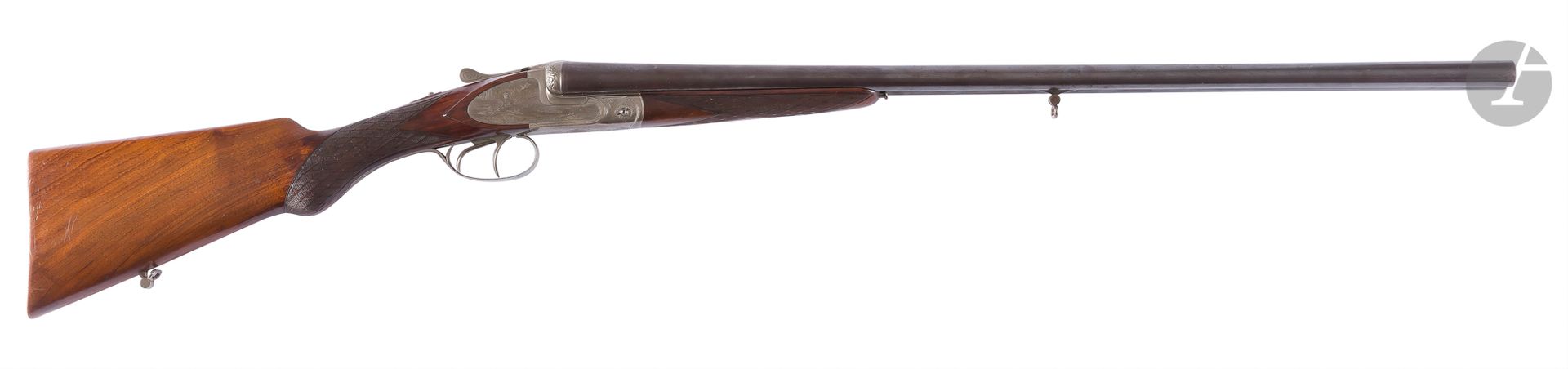 Fusil de chasse à faux corps, deux coups, calibre 16/65, extracteur. {CR}Canons juxtaposés. Faux corps gravés, fermeture «Hélice». Crosse en noyer. {CR}Longueur canon : 70 cm. Longueur totale : 110 cm. {CR}Catégorie C à déclarer, n°67**. {CR}n°6739
