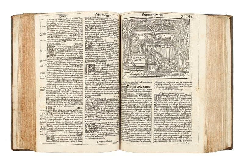 [BIBLE]. Biblia cum concordantijs veteris et noui testamenti et sacrorum canonum... (Lyon: Jacques Mareschal), 1527. In-folio, (14 ff.), 296 ff., (24 ff.). [sig. aa8 bb6 a-r8 s6 A-R8 S-T10 AA-CC8] - Veau brun, dos à nerfs orné, tranches mouchetées (reliure du début du XVIIIe siècle). Belle et rare Bible gothique imprimée sur 2 colonnes, annotée par Alberto Castellano et avec les notes historiques de Johannes de Gradibus. Elle suit l'édition de 1525 parue à la même adresse. Riche illustration se composant d'un titre gravé représentant Saint-Jérôme au centre dans un bel encadrement, de nombreuses vignettes et lettrines dans le texte dont une grande au feuillet 141, attribuées à Guillaume II Le Roy, et de deux bois à pleine page, la Création du monde en tête de la Genèse et une copie de la Nativité de Hans Springinklee en tête du Nouveau Testament. Exemplaire provenant de l'abbaye Sainte-Trinité de La Lucerne en Normandie, avec ex-libris manuscrit sur la première garde. Reliure présentant au dos la frise au Dauphin couronné. Coiffe de tête arrachée, coins abîmés, quelques griffures et tache sur les plats. Bon état intérieur, malgré plusieurs feuillets restaurés notamment au début du livre, avec légère atteinte au texte. Exemplaire rogné court dans la marge supérieure, atteignant parfois la foliotation.