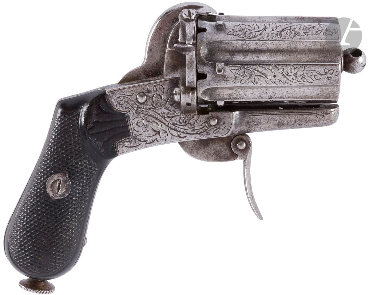 Pinfire revolver, six shots, 7 mm caliber.
Hollow barrel and engraved frame. Folding trigger. Checkered ebony stock plates.
B.E. Circa 1860-1870.
