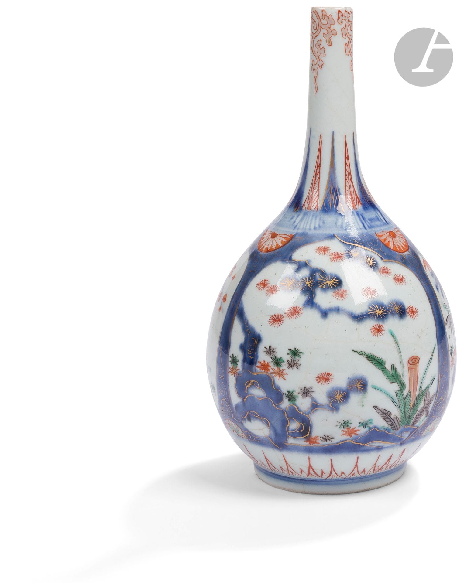 Imari porcelain bottle vase, Japan, 18th
centuryDecorated in blue underglaze and enamels on red, gold and green glaze in reserves of the three friends of winter (plum tree, bamboo and pine). The neck is decorated with a tako karakusa (octopus tentacles) enamelled in red overglaze.
Height: 23.4 cmRest of a
label from a store on Bd Haussmann.

十八世纪，日本青花伊万里岁寒三友图瓷瓶




