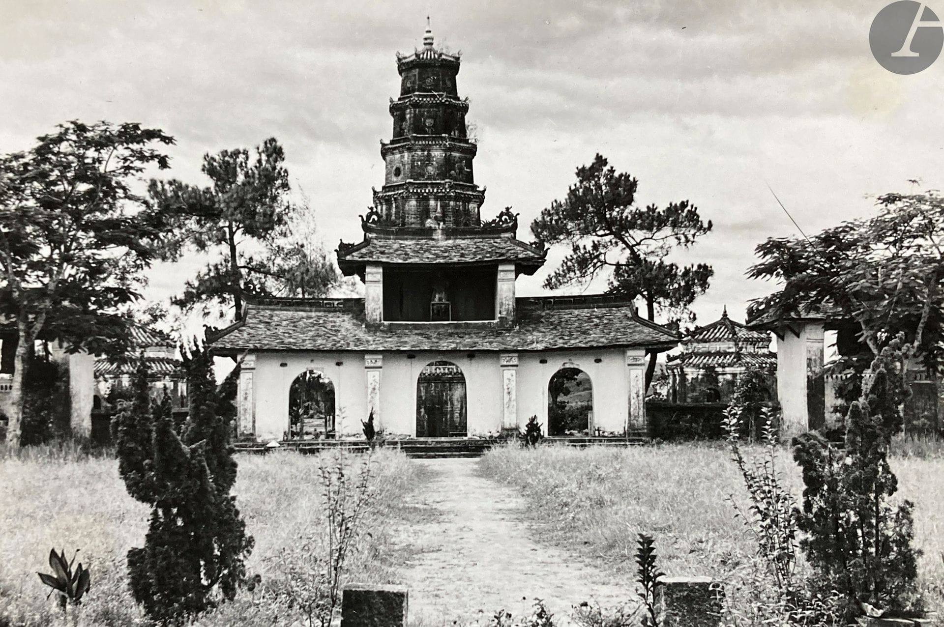Unidentified amateur photographer 
Vietnam. Hue, c. 1930. 
Royal Park, Hô Tinh-Tam. Shopping street. Hue. Dong-Ba market. The Palace at the four cardinal points without worries. Return from school. Suburb of Kim-Long. Botanical garden of Nguyen-Hoang. Outside corner of the citadel. Moat with lotuses. Unicorn in bronze. Pavilion of the Talks. Interior of the citadel. Mirador and pavilions. Thuong-Bac. Bridge with golden waters. Perfume river. Chua Ong Temple. Floating village. 
Album small in-4 oblong, dedicated on the second cover (signature illegible), composed of 46 silver prints of the period, pasted on cardboard and separated by serpents. Numerous typed captions on labels, pasted on the mounts. 
Average size : 12 x 18 cm 

Unidentified amateur photographer 
Vietnam. Hue, c. 1930. 
Royal Park, Hô Tinh-Tam. Shopping street. Hue. Dong-Ba market. The Palace at the four cardinal points without worries. Return from school. Suburb of Kim-Long. Botanical garden of Nguyen-Hoang. Outside corner of the citadel. Moat with lotuses. Unicorn in bronze. Pavilion of the Talks. Interior of the citadel. Mirador and pavilions. Thuong-Bac. Bridge with golden waters. Perfume river. Chua Ong Temple. Floating village. 
Oblong 4to album, dedicated (signature illegible), composed of 46 vintage gelatin silver prints, mounted on cardboards. Numerous typed captions on labels.
Dimensions : 12 x 18 cm









