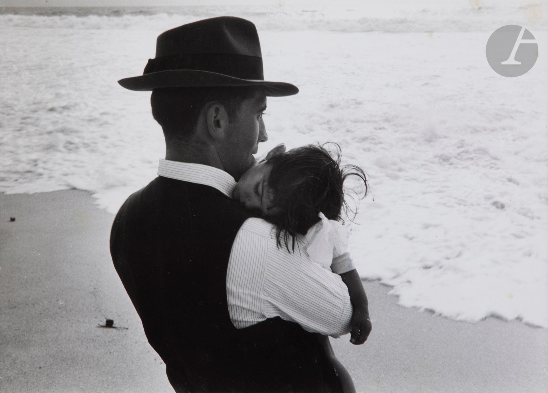 Édouard Boubat (1923-1999
)Nazaré [father and child]. Portugal, 1956. 
Silver print from the period. Agency stamps, handwritten annotations and cropping indications on the reverse. 
15,5x23,3cm - frame


