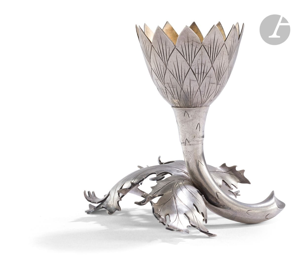 FRANCE ART NOUVEAU PERIOD 
Chromed metal egg cup representing an artichoke on its branch. The plain cup rests on a rectangle in the imitation of knife holders
Minerva mark
Goldsmith : Pierre-François QUEILLE
Weight : 48 g - height : 8,6 cm

