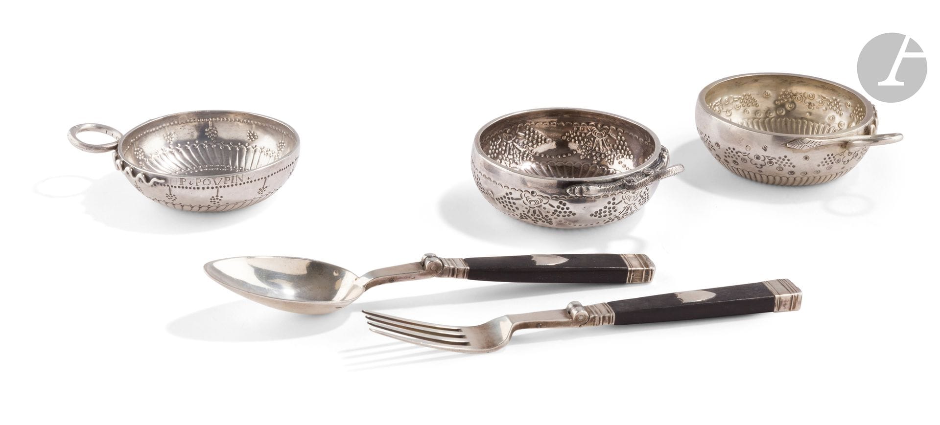 FRANCE PARIS PROVINCE XIXth CENTURY
Two silver wine cups with snake handle:
 - AURILLAC 1819 - 1838, second title, embossed with twisted gadroons, then with ocelots framing stylized bunches of grapes, engraved A. PONS. DAUFI.
 Goldsmith : Jean BEILLIE ANDRAL, registered in 1829
Weight : 87 g 
 - PARIS 1819 - 1838 , repoussée of twisted gadroons then stylized bunches of grapes, engraved J. FABRE.
Goldsmith : Charles Marie GUIDEE, registered in 1801
Weight : 136 g