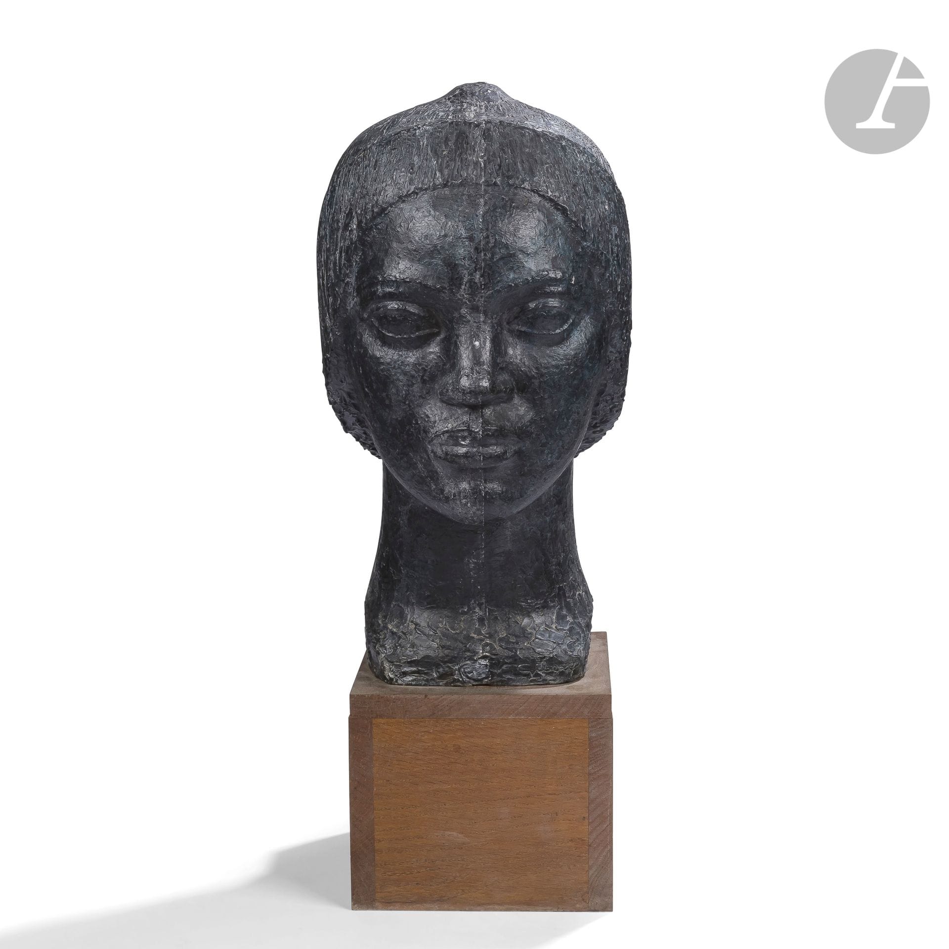 LUCIEN GIBERT (1904-1988
)African
womanSculpted
portrait
. Proof in plaster with black patina. Cubic base in oak. Signed GIBERT towards the base of the neck in front. H. with base : 74 cm - H. sculpture alone : 54 cm

