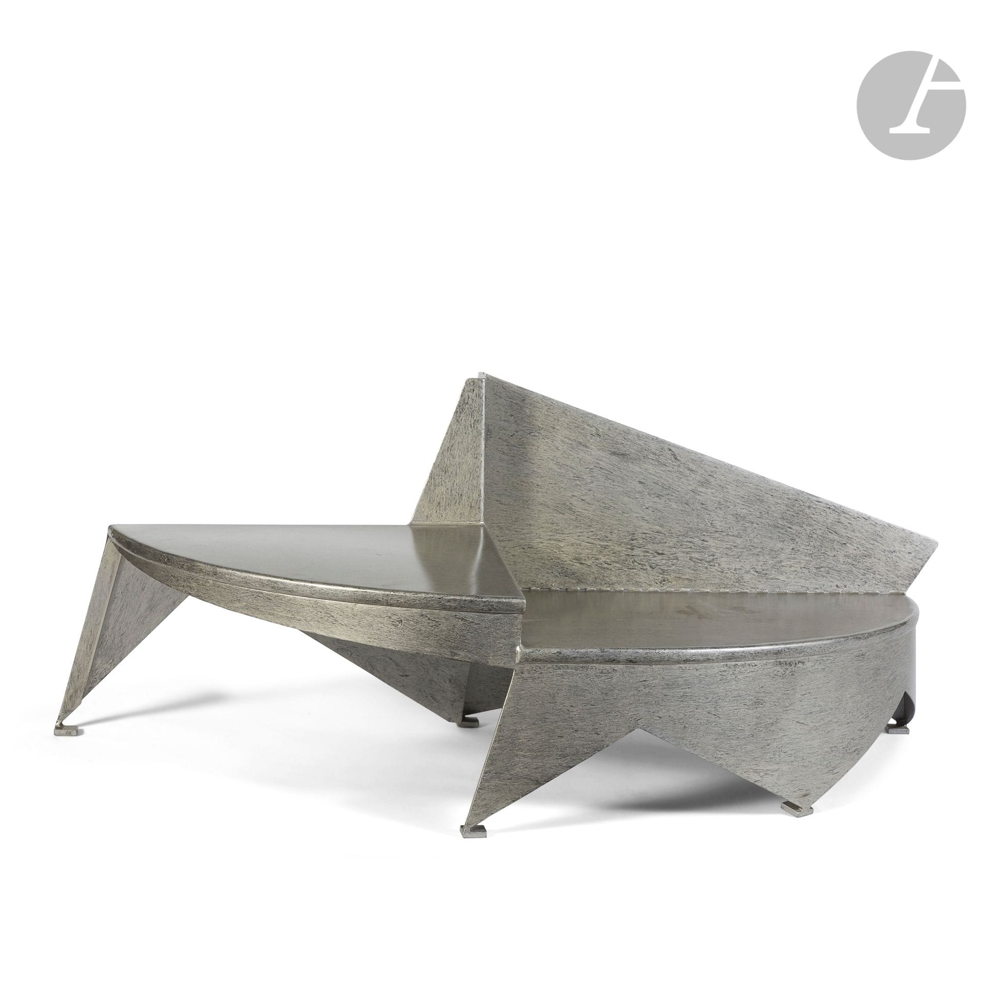 YVES DE LA TOUR D'AUVERGNE (BORN IN 1927
)Half-moon, 1984, print numbered E.A.
1-DB84Asymmetrical low
table
. Proof in patinated stainless steel. Marked with the artist's monogram on the back and on the reverse, numbered E.A. 1-DB84 on the reverse. H. 49 cm - W. 130 cm - D. 53 cmProvenance

:
Succession M. and Mme B., Paris. From an important decoration made by Isabelle Hebey in the years 1980-1990 for their apartment in the 8th district.

Bibliography :
Pierre Daix (texts by) - Yves de la Tour d'Auvergne - Editions Benteli, Bern, 2000
.
An identical piece of furniture is reproduced on page 139.







