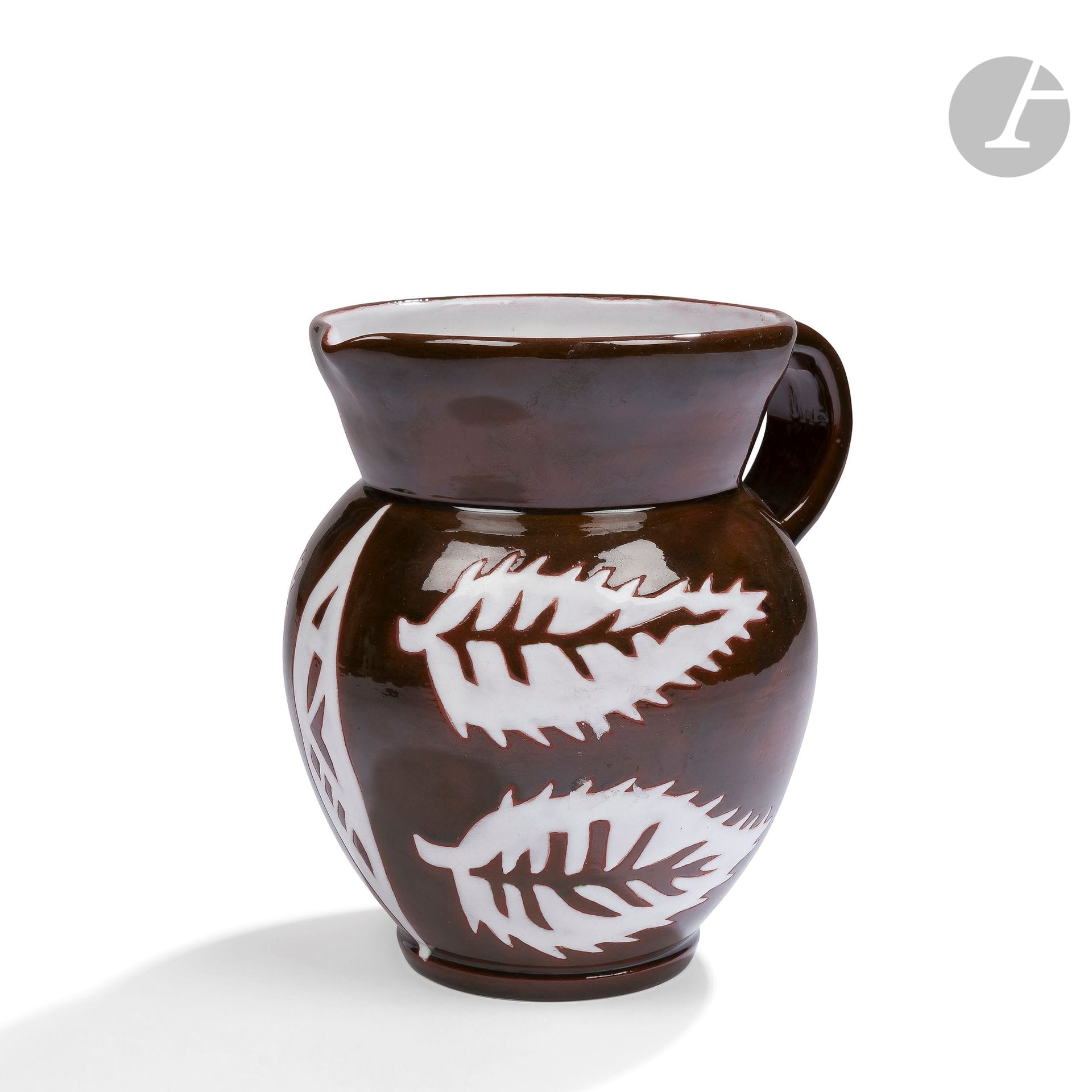 JEAN LURÇAT (1892-1966) PAINTER CARTONNIER & SANT-VICENS POTTERY
, proof N°
73/100Ovoid
pitcher
on a small heel with a detached handle, the neck widely flared. Ceramic proof with polychrome enamelled decoration; white slightly cracked on a shaded brown background. Marked Drawing J. LURÇAT Sant-Vicens, numbered 73/100 and bears the letters A.Z.A on the reverse. H. 19,4 cm

