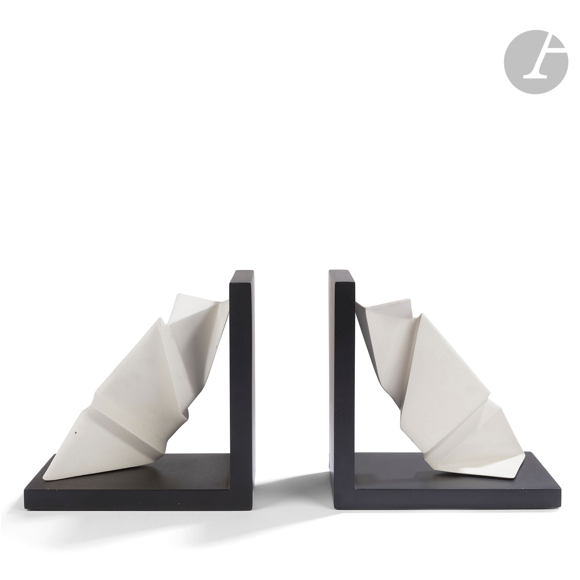 YVES DE LA TOUR D'AUVERGNE (BORN IN 1927
)Untitled, numbered prints 1/80Pair of
bookends. Marble powder and resin prints; black, white. Each piece monogrammed and numbered 1/80 on the white part. H. 22 cm - L. 22 cm - L. 15 cmProvenance

:
Estate of M. and Mme B., Paris. From an important decoration made by Isabelle Hebey in the years 1980-1990 for their apartment in the 8th district.




