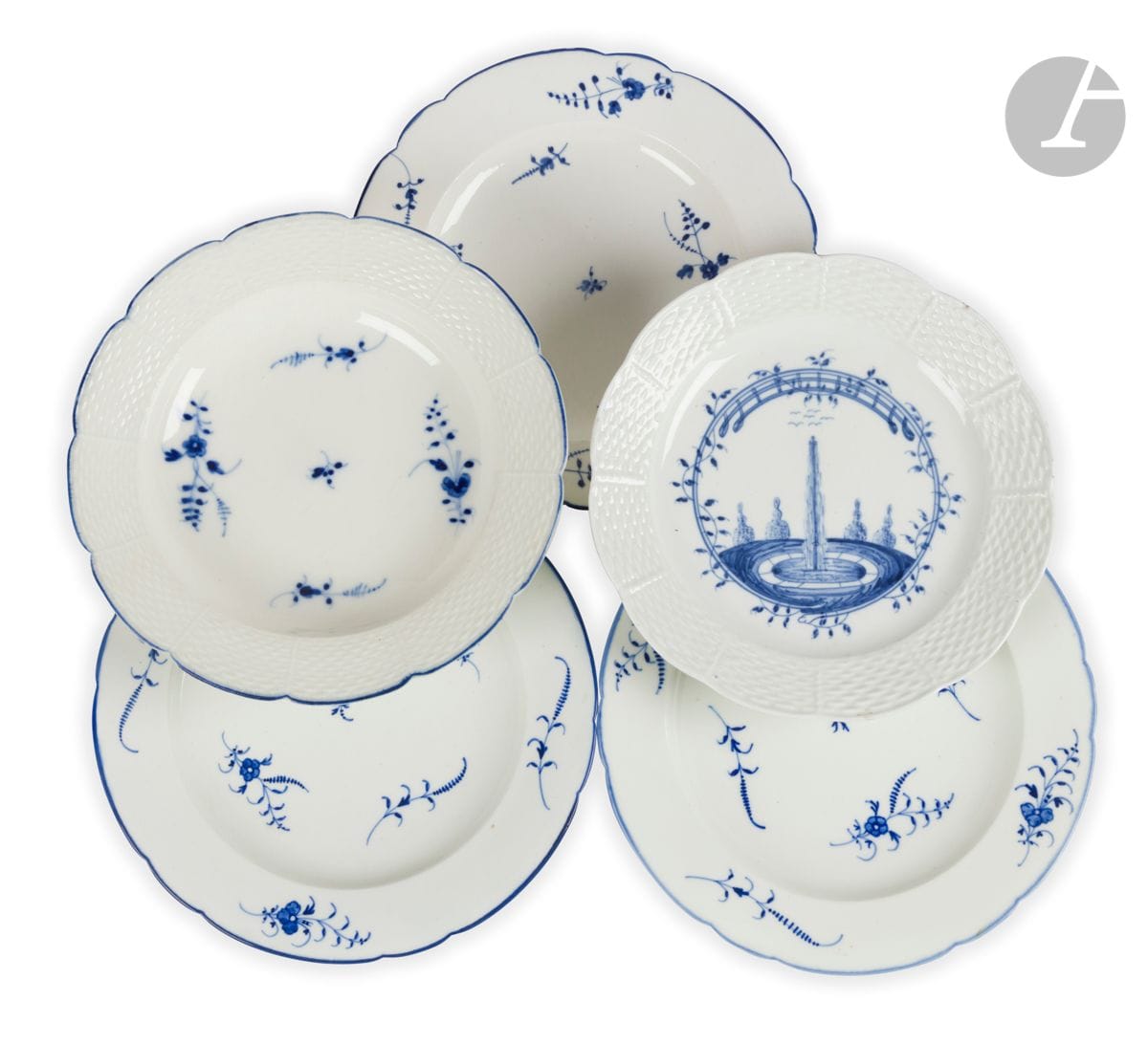 Chantilly
Lot of five soft porcelain plates with contoured edges decorated in blue monochrome including one plate with water jet decoration and basketry motifs in relief, one plate with twig decoration and basketry motifs in relief and three plates with twig decoration.
Marked; hunting horn in blue.
18th century. 
D : 25 cm and 23 cm
A small chip on the plate with the water jet.