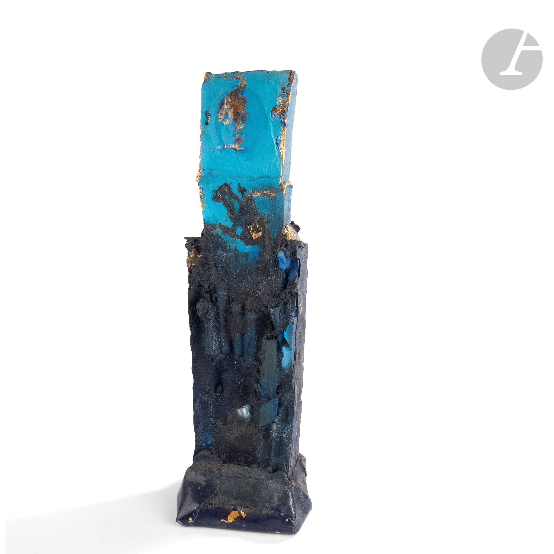 Raymond MARTINEZ (France, born in 1944) 
The Sphinx, 1992Sculpture
totem in glass paste decorated with marine backgrounds and faces appearing in cameo, gold added, base decorated with painted metal. Signed and dated 1992 on one side. H. 53 cm - L. 17 cm - D. 19 cm

