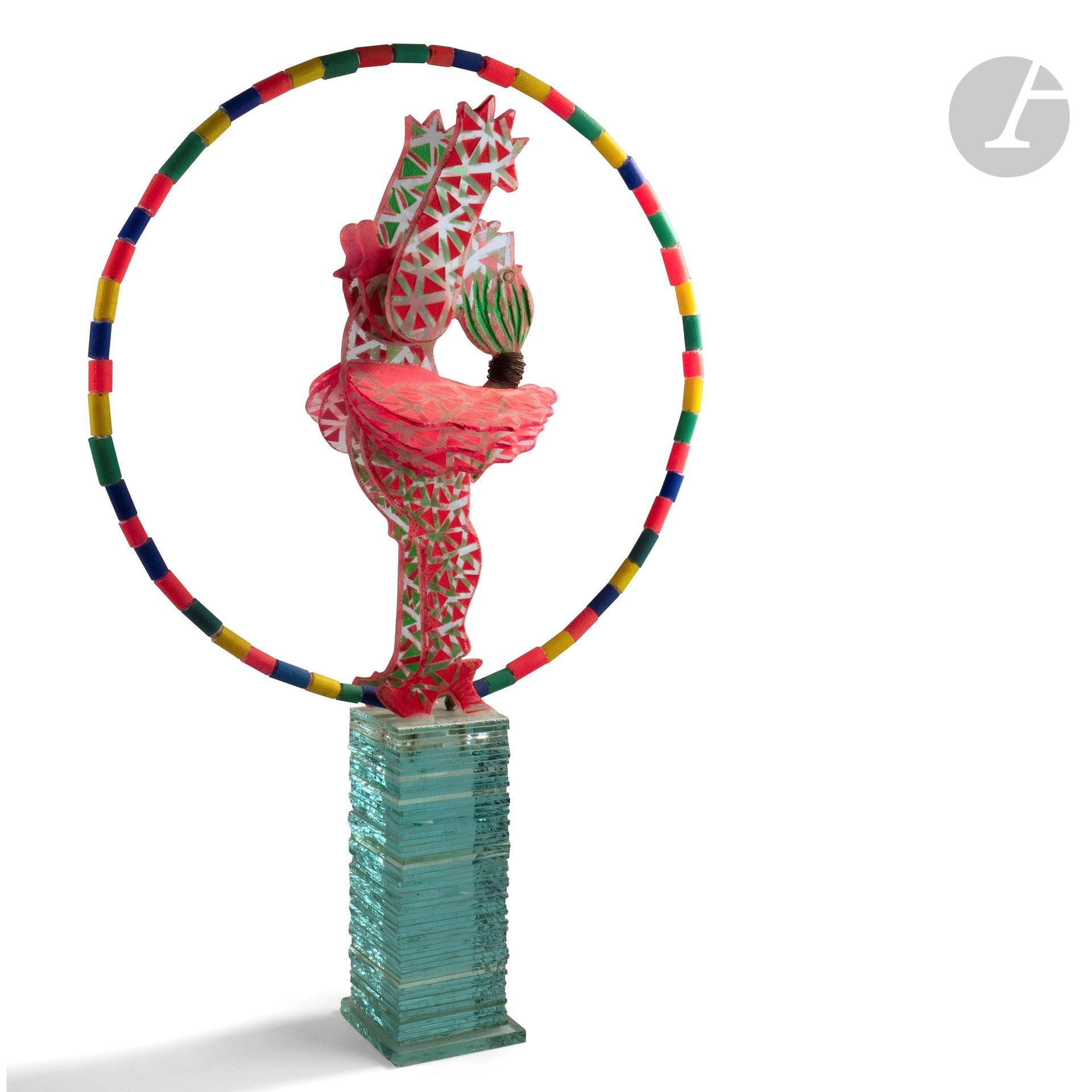 MARCOVILLE (France, né en 1939) 
Nana
Sculpture en verre taillé, sablé et peint représentant une danseuse entourée d’un cerceau de cylindre de verre sur un arc en métal, surmontant un socle de lamelles de verre. Signée en haut du socle.  H. 74 cm - Socle : 11 cm de côté - D. du cerceau : 50 cm

Exposition : Sculpteur de rêves, Château de Vascoeuil, 2015.