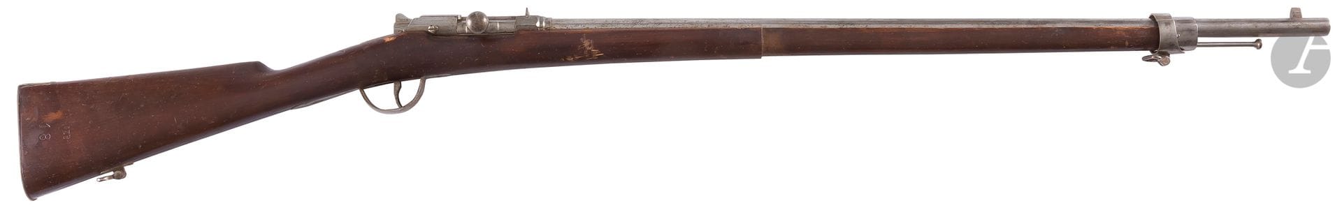 Fusil Gras des bataillons scolaires pour la manœuvre. 
Canon rond. Garnitures en fer. Crosse en noyer avec marquages « Nicolas Paris » et « AZE 18 ». Baguette inamovible en fer. 
Longueur totale : 114 cm
