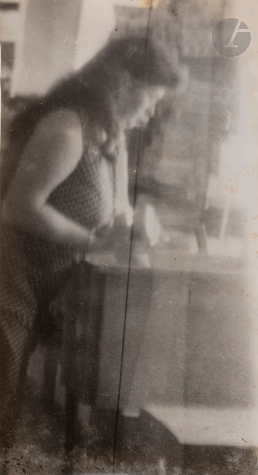 Miroslav Tichy (1926-2011)  
Untitled [woman leaning], c. 1960-1970. 
Vintage silver print mounted on cardboard by the corners.  
15.5 x 9 cm

Vintage gelatin silver print mounted on cardboard by the corners.  
15.5 x 9 cm