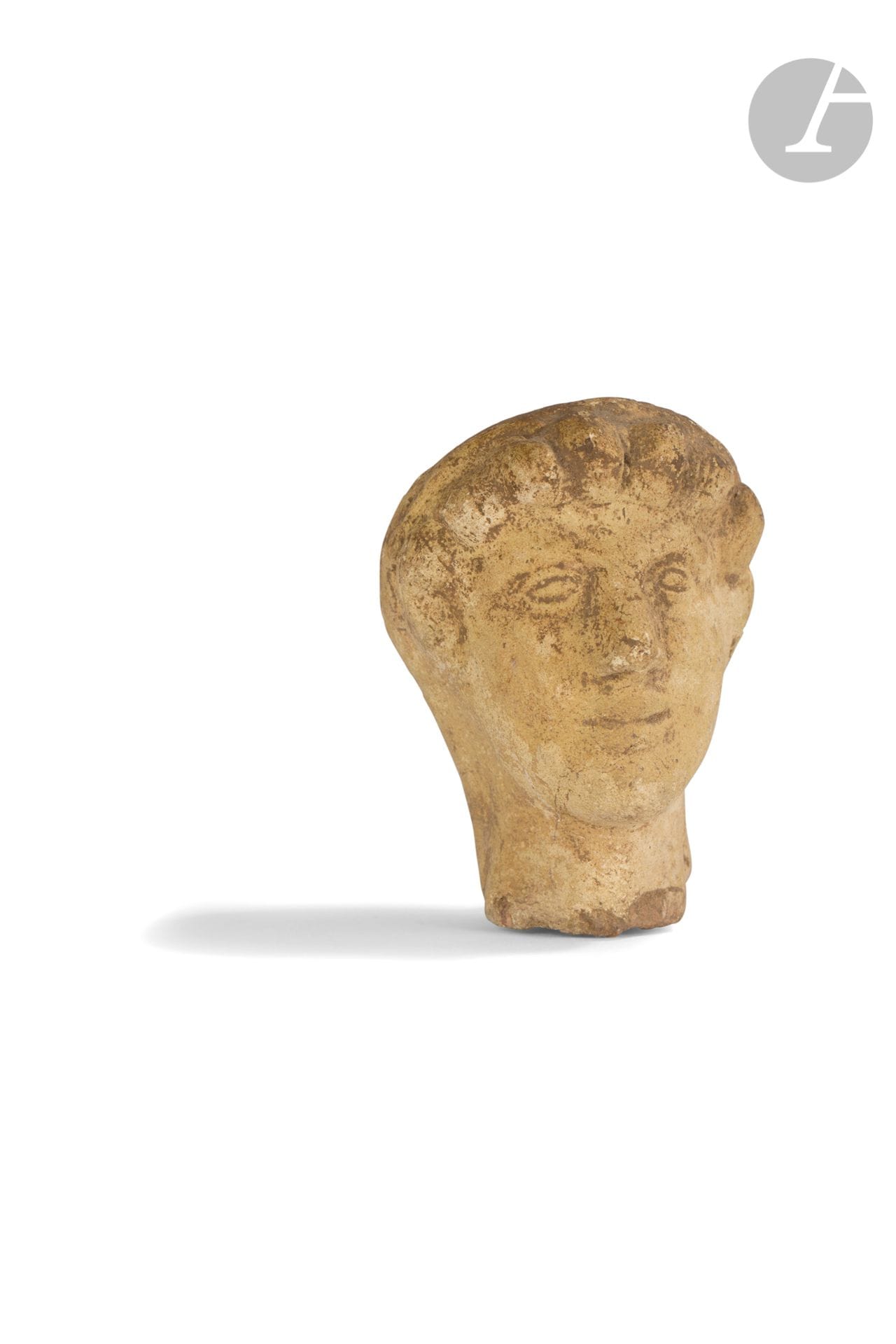 Male head
Beige terracotta.
Etruscan art, 3rd-2nd century B.C. 
Height : 7,8 cm
 
An Etruscan Terracotta Male Head, 3rd-2nd century BC