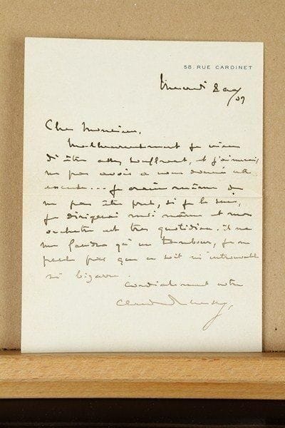 Claude DEBUSSY (1862-1918)
L.A.S., Paris mercredi 8 [9] avril 1903, à Marcel Labey ; 1 page in-8 à son adresse 58, rue Cardinet, enveloppe.Malheureusement il vient d'être assez souffrant, « et j'aimerais ne pas avoir à vous donner cette excuse... Je crains même de ne pas être prêt, si je le suis, je dirigerai moi-même et mon orchestre est très quotidien. Il ne me faudra qu'un tambour, je ne pense pas que ce soit ni introuvable ni bizarre »... [Il s'agit du concert du 21 avril 1903, où Lucienne Bréval chanta les Chansons de Bilitis, et Debussy joua finalement la version pour deux pianos des Nocturnes, avec Ricardo Viñes.] Reproduction ci-dessous 
