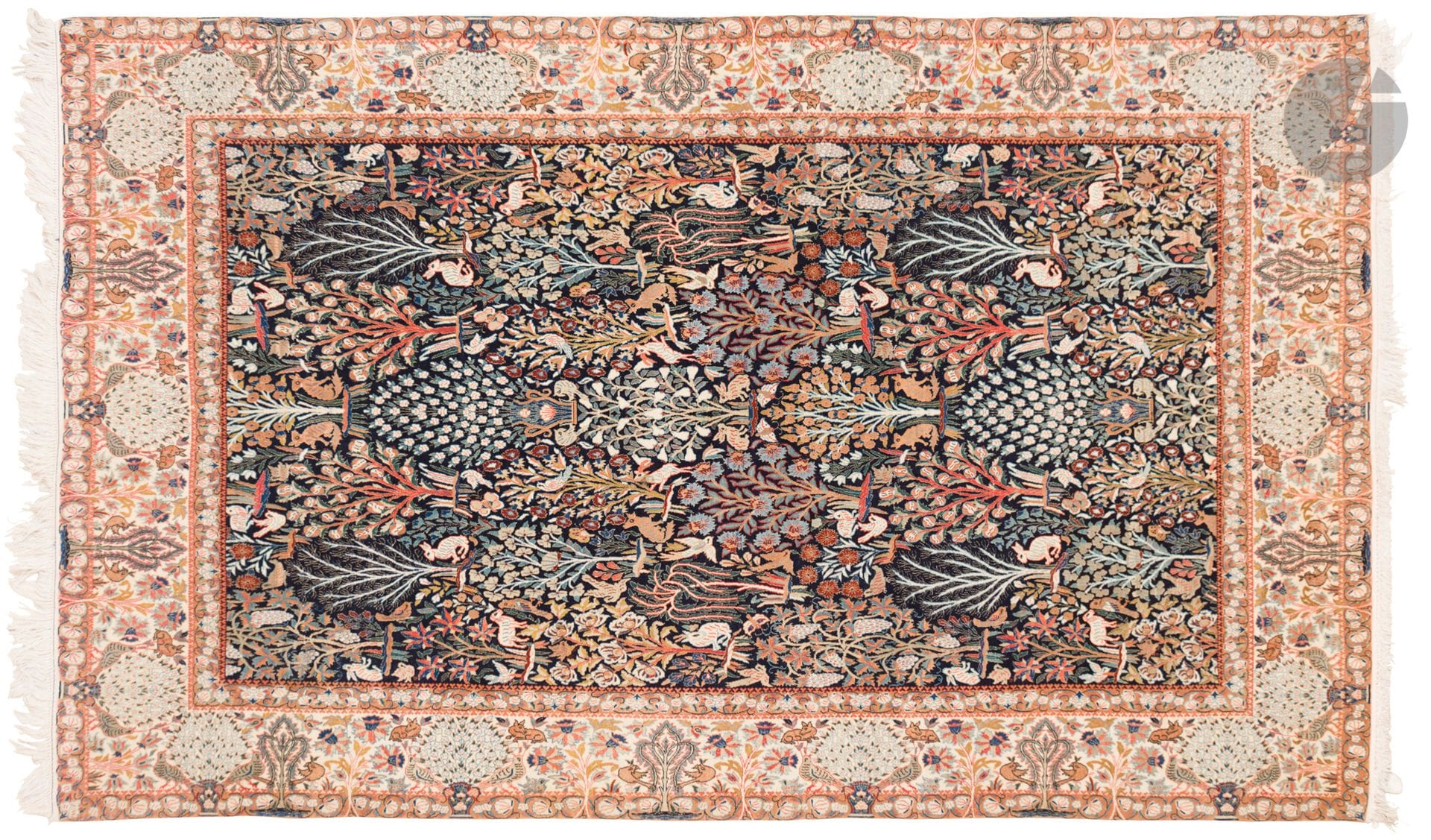 NAIN, XXth century, wool and silk velvet (5%), silk chains.
Carpet with a navy blue background decorated with vases and flowering shrubs dotted with animals and birds, large ivory borders with bouquets of flowers and animals. 
147 x 271 cm