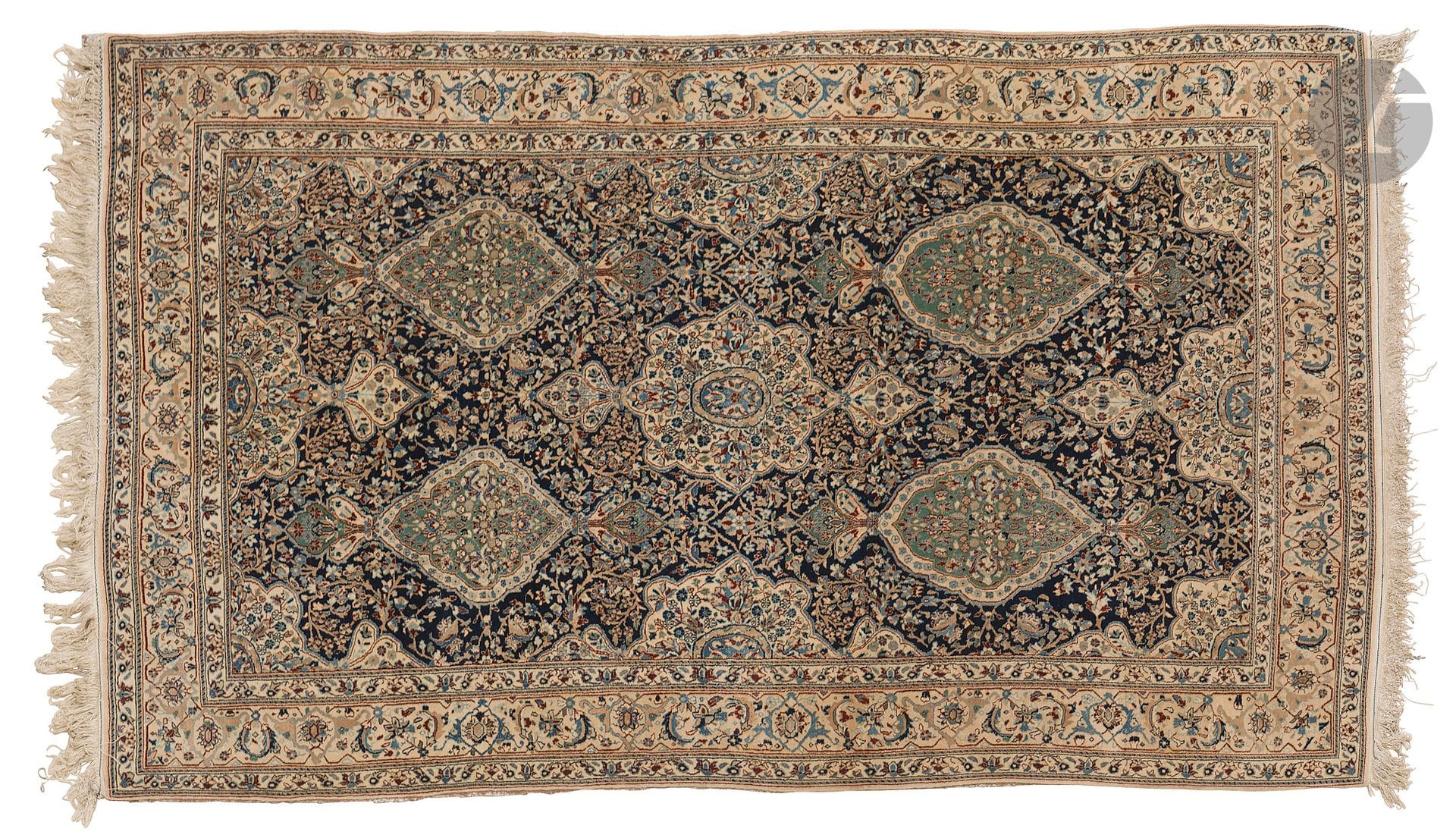 NAIN, XXth century, wool velvet, cotton warps and wefts.
Carpet decorated with five medallions on a navy blue background dotted with flowers, gray border with garlands of flowers. 
214 x 129 cm
Stained and deformed.