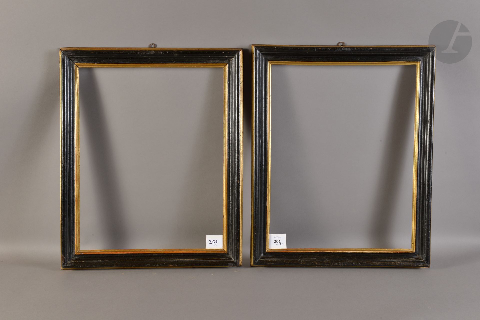 Pair of black and gold molded wood chopsticks. Italy XVIIth century. 35 x 45,2 cm and 35 x 44,5 cm - Profile : 4,5 cm (8F)