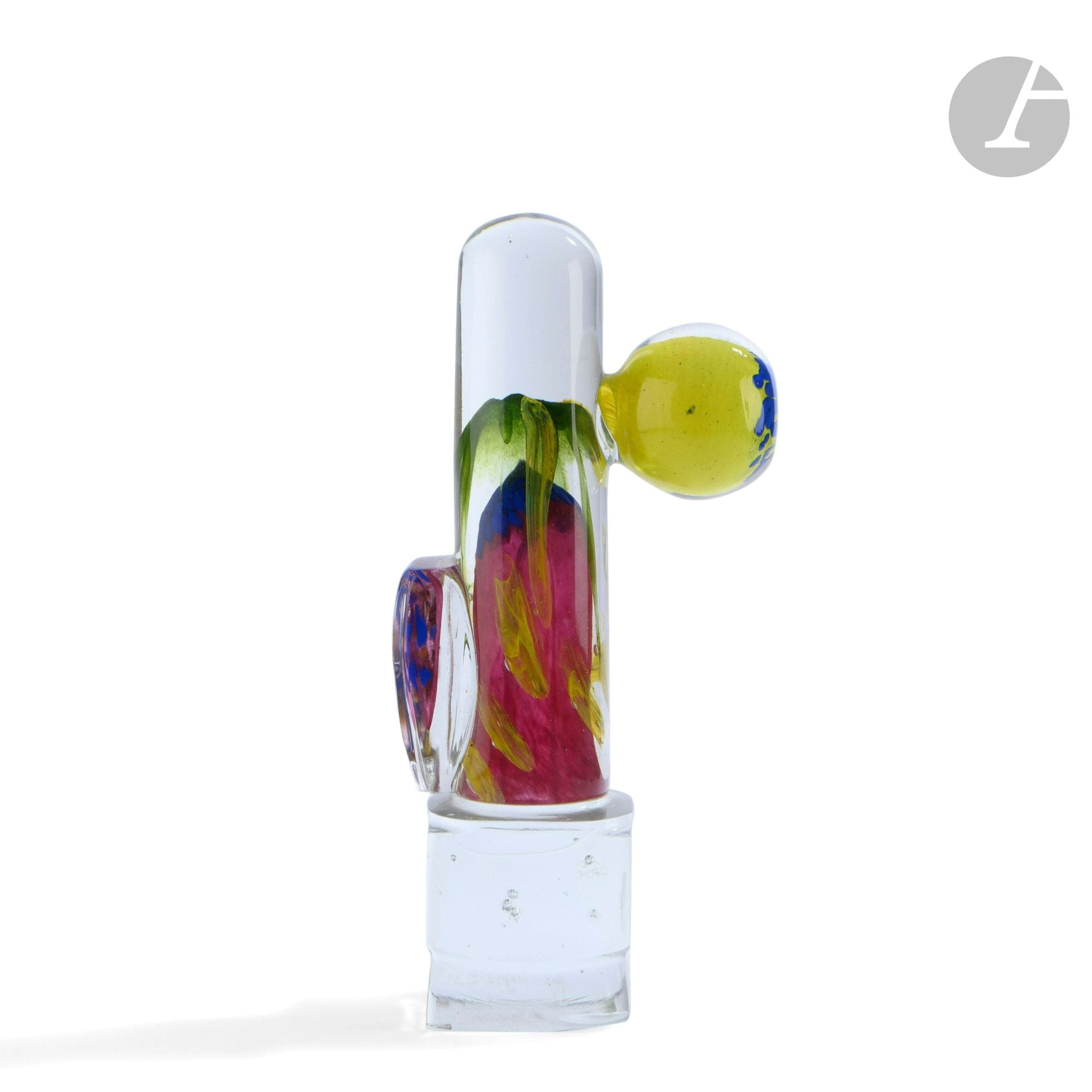 René DENIEL (France, born in 1947)
Blown glass sculpture in the form of a polychrome cylinder resting on a square cut foot, a glass cord and a yellow and blue ball applied to the surface. Signed and dated (19)91 on the base, monogrammed and noted 1/1 under the base. H. 36 cm - W. 16 cm - D. 9 cm
