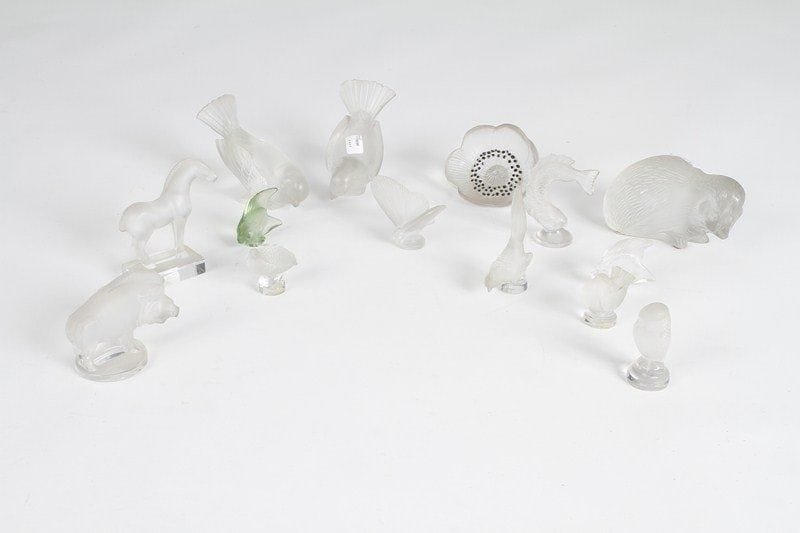René LALIQUE ou LALIQUE FRANCE
Quatorze sujets décoratifs en verre satiné. Signés. Petits éclats.