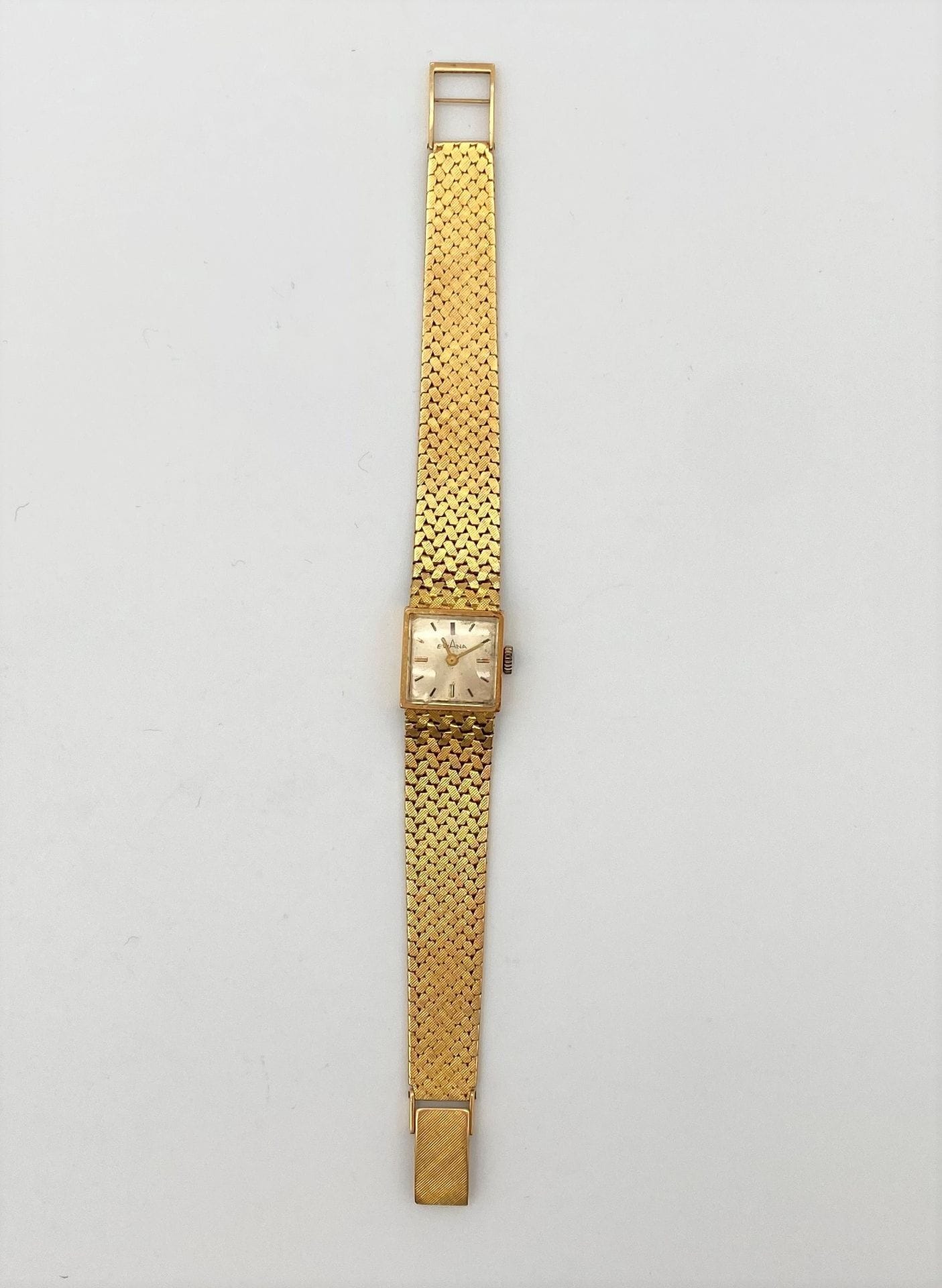 Montre de dame EVANA carrée en or (18K), bracelet ruban. Poids brut : 38 g