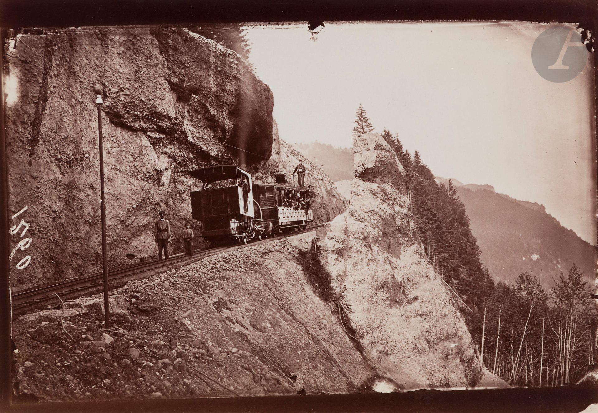 Maison Adolphe Braun
Chemins de fer des Alpes, c. 1866-1890.
La montée après la station de Wengern. Station de chemin de fer à Stans. Oberarth, chemin de fer. Station de Scheidegg avec l’Eiger et le Moine. Chemin de fer de Lauterbrunnen. Chemin de fer du Rigi Arth. Station de Wengernalp. Vallée de Grindelwald et le Wetterhorn. Station Alpnachstad. Vue vers Stans depuis la station de Kalti. Chemin de fer de la Schynige Platte, vue vers la Jungfrau. Station de Grindelwald. Tunnel à Airolo. Chemin de fer et hôtel du Stanserhorn. Station de Brunnen, les Mts Uri Rothstock et Bauen. Chemin de fer de l’Oberland Bernois. Chemin de fer du Pilate.
20 épreuves sur papier albuminé. Numéros d’inventaire et annotations manuscrites aux versos. Quelques numérotations dans les négatifs.
Formats : de 12 x 17 à 24 x 29 cm