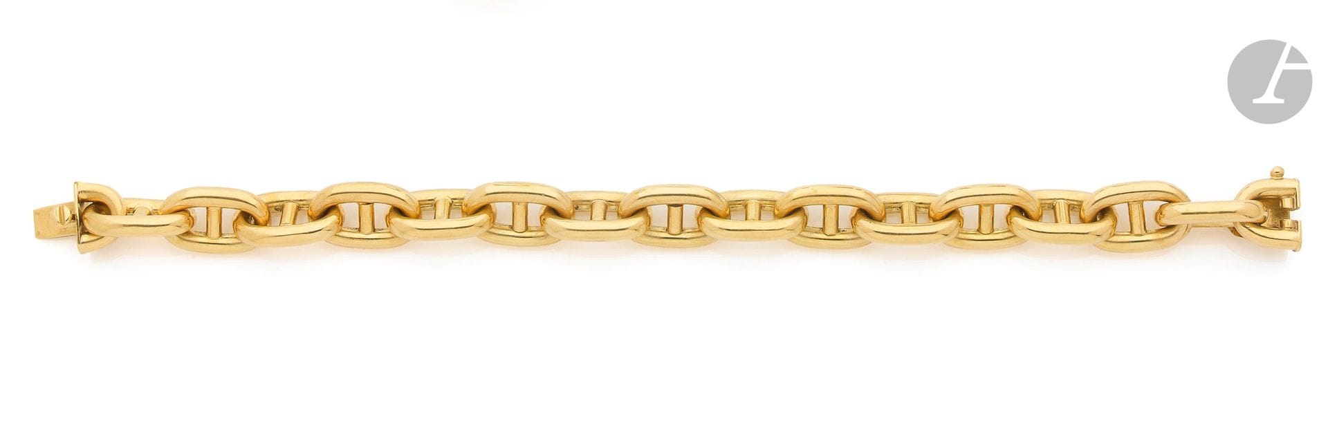 Bracelet en or 18K (750), articulé de maillons marines. Longueur : 20,5 cm environ. Poids : 36,2 g

A gold bracelet