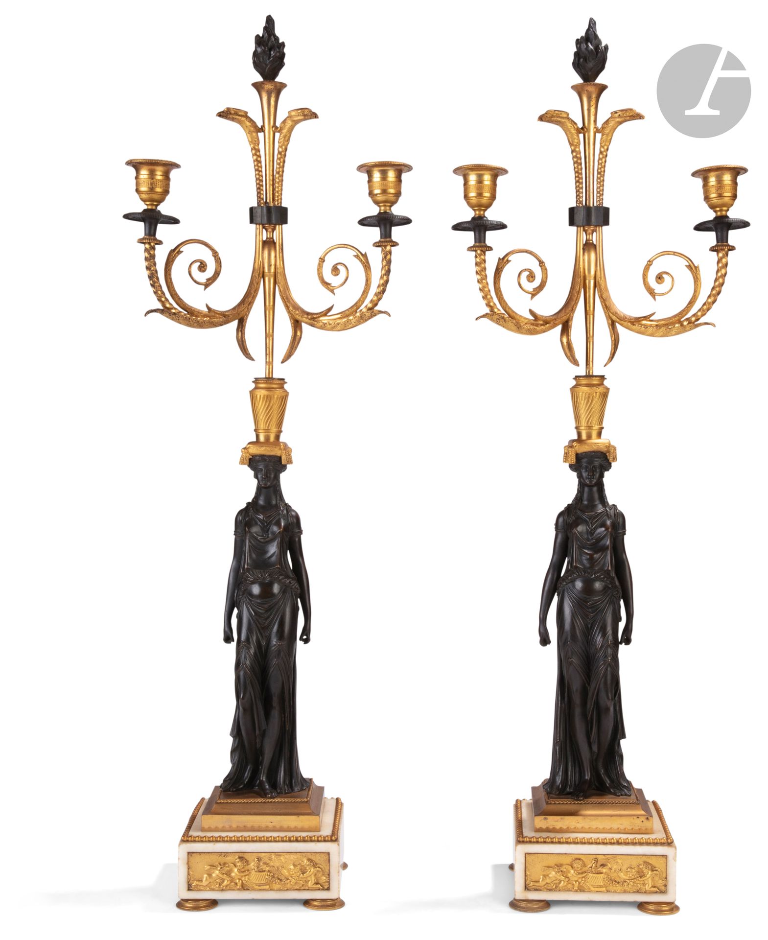 Pair of candelabras with vestals in patinated bronze and gilt bronze, with two lights, resting on bases representing children's games.
First half of the 19th century.
H : 70 cm