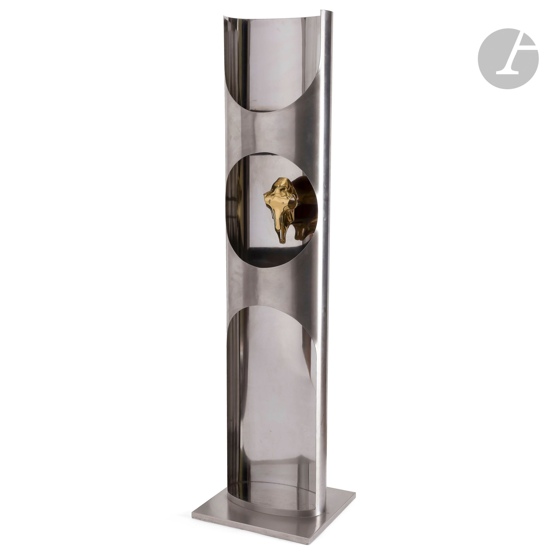 MARIA PERGAY (BORN 1930)
Totem also known as Bucrane 
Floor lamp in stainless steel.
The rectangular base and the exterior of the oval, partially openwork shaft are brushed.
The interior has a glossy finish and a gilded bronze decorative title motif.
Circa 1970.
The oval shelf above the bucranium is missing.
Height: 162 cm - Length: 43 cm - Depth: 39 cm

Bibliography
Suzanne Demisch &amp; Stéphane Danant - Maria Pergay, complete works 1957-2010 - Éditions Damiani, Bologna, 2011. A model identical to our floor lamp is reproduced on the full page and referenced under number 77A.