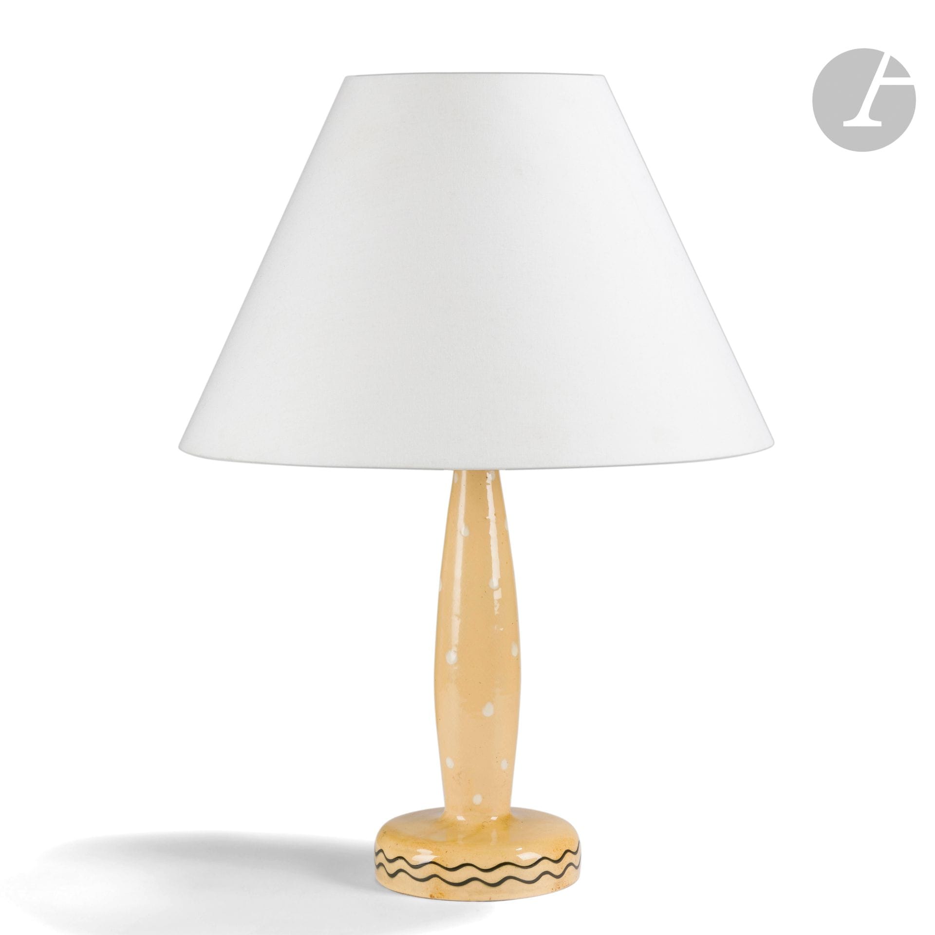 FRANCIS JOURDAIN (1876-1958)
Pois et vaguelettes 
Pied de lampe ; la base circulaire, le fût fuselé.
Épreuve en céramique émaillée polychrome ; les pois traités blanc et les vaguelettes traitées noir, sur fond jaune.
Années 1920.
Monogrammé F. J. à l’émail et porte le numéro 3012 en creux sous la base.
Hauteur céramique seule : 33 cm

Collections publiques :
Musée d’Art et d’Histoire de Saint-Denis – Un pied de lampe identique est conservé dans les collections de cette institution sous le numéro d’inventaire 97.12.03.

Exposition : 
Francis Jourdain ; un parcours moderne 1876-1958 – Exposition itinérante entre mars 2000 et avril 2001 ; musée Toulouse Lautrec d’Albi, musée-bibliothèque André Benoît d’Alès, musée d’Art et d’Histoire de Saint-Denis, musée d’Art et Industrie de Roubaix. Un pied de lampe identique fut présenté lors de cette manifestation.

Bibliographie : 
Collectif - Francis Jourdain ; un parcours moderne 1876-1958 – Catalogue de l’exposition itinérante entre mars 2000 et avril 2001 ; musée Toulouse Lautrec d’Albi, musée-bibliothèque André Benoît d’Alès, musée d’Art et d’Histoire de Saint-Denis, musée d’Art et Industrie de Roubaix ; Somogy Éditions d’Art, Paris, 2000. Un pied de lampe identique reproduit en pleine page 104 et en 4e de couverture.