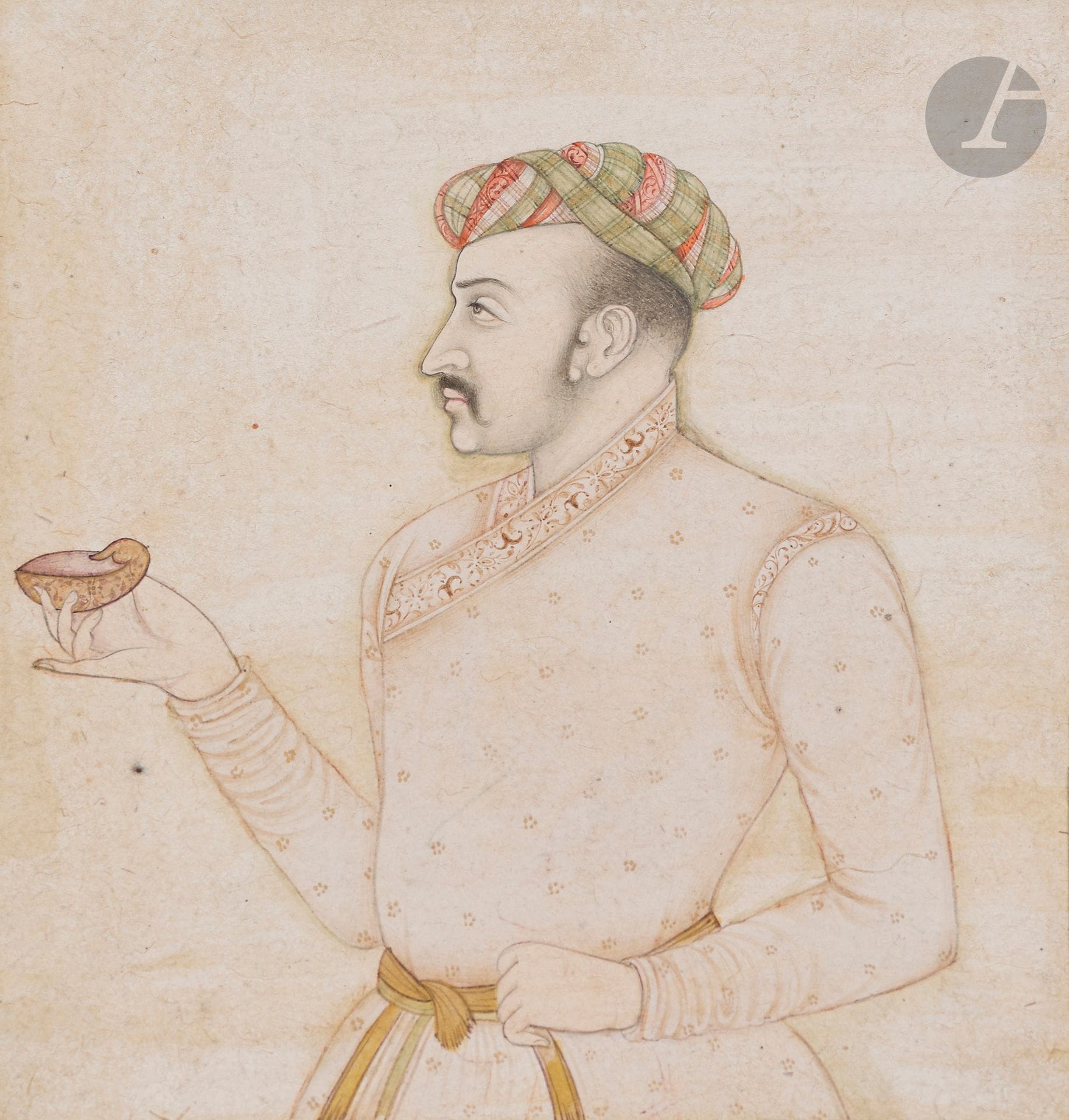 Bust portrait of Prince Khurram, future Emperor Shah Jahan, India, 19th century
Ink, gouache and gold on paper depicting Prince Khurram. Recognizable by his moustache and the double curl of his sideburns, the future emperor is shown in bust, facing left, holding a hardstone wine cup and wearing a red and green turban.
Painting size: 11.3 x 10.4 cm; page size: 16.6 x 13.1 cm
Retouching, notably on the outline of the figure, elements added to the frame. In a window cartonnage.
Attached is a manuscript folio, India, 19th - 20th century, with 9 lines of text in Persian nasta'liq, a star medallion painted with a gallant scene on one side. Dim. folio: 33.3 x 21 cm. Wormholes, missing parts, tears. In window cardboard.

A Prince Khurram Portrait, India, 19th century