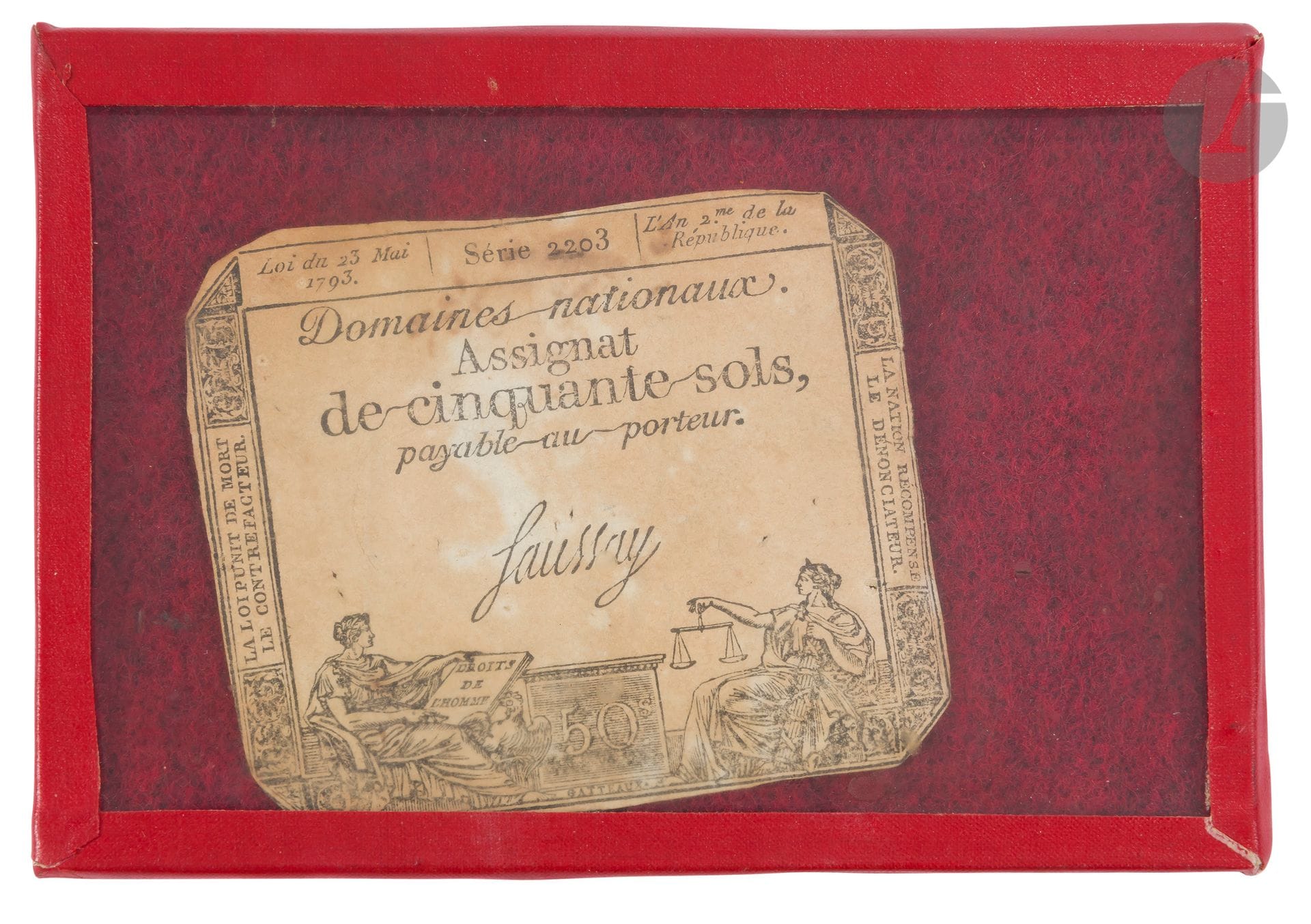 Assignat de cinquante sols. 
« Loi du 23 mai 1793 série 2203, l’an 2e de la République », « La Loi punit de mort le contrefacteur ». « La Nation récompense le dénonciateur » 
Sous verre (rousseurs).