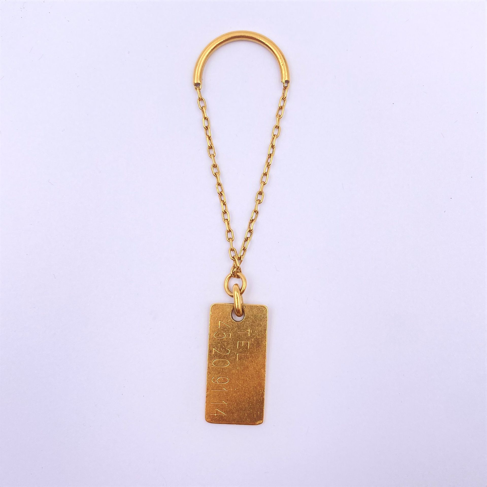 Porte clé en or jaune (18K). Poids 12.4 g

Frais acheteur pièces et lots en or : 9,6% TTC -  8% HT 
