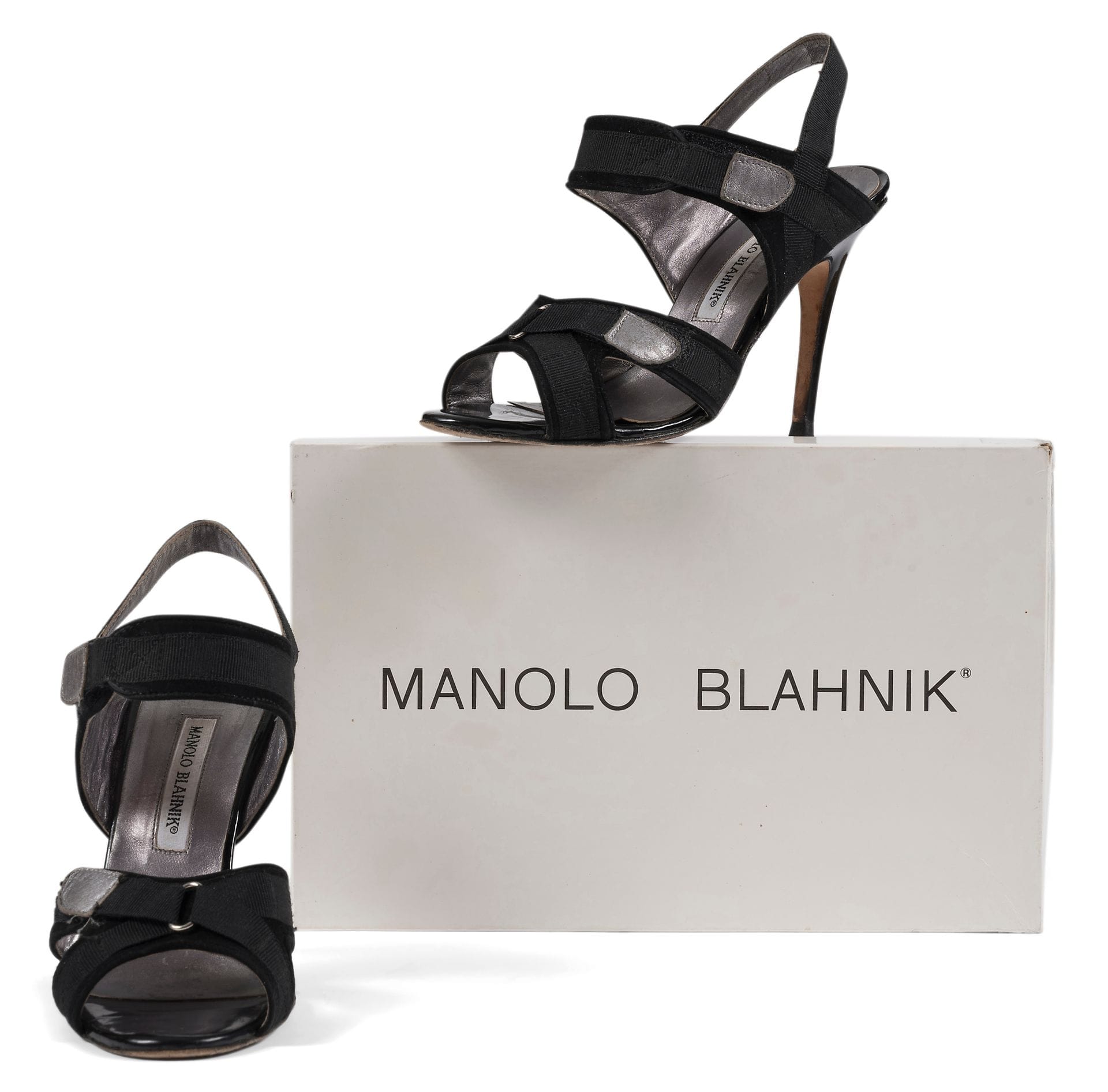 Manolo BLAHNIK
Pair of heeled sandals in black fabric and silver leather velcro, S.37 shown, box (traces of use)