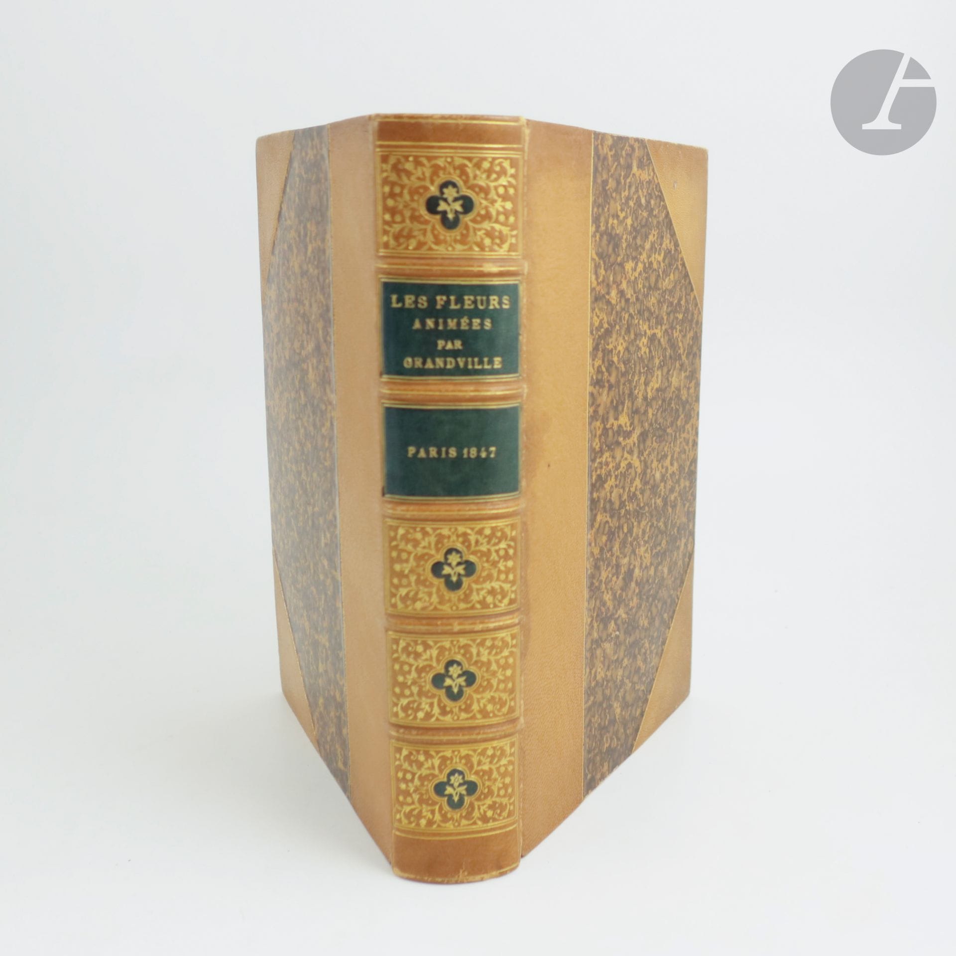 [GRANDVILLE].
Flowers animated by J.-J. Grandville. Introductions by Alph. Karr. Text by Taxile Delord. Première [-Deuxième] partie.
Paris : Gabriel de Gonet, 1847. - 2 parts in one volume, in-8, lemon half-maroquin with corners, gilt fillets, spine ribbed with gilt and mosaic motifs, gilt edges (Pagnant).

First edition of this famous collection of tales inspired by flowers and written by Alphonse Karr, Taxile Delord and Louis-François Raban, the latter presented under the pseudonym Comte Fœlix.

This is undoubtedly one of the most original and attractive books illustrated by Grandville. It features two color woodcut frontispieces by Porret and Quichon, and 50 color plates engraved on steel by Geoffroy. The majority of the illustrations depict human beings disguised as flowers, sometimes accompanied by animals whose mannerisms are human.

At the end of the second part is "Botanique et horticulture des dames" by Fœlix, with an introduction by Alphonse Karr, illustrated with two black botanical plates.

A first-edition copy, in second state, recognizable by the words "Fin de la première partie" at the bottom of page 262.

A very fine copy bound by Pagnant.
Rubbing to headpieces and corners. Spine and edges of boards browned. Stains on pages 200 and 201, as well as on the plate between these pages depicting the Hemlock.