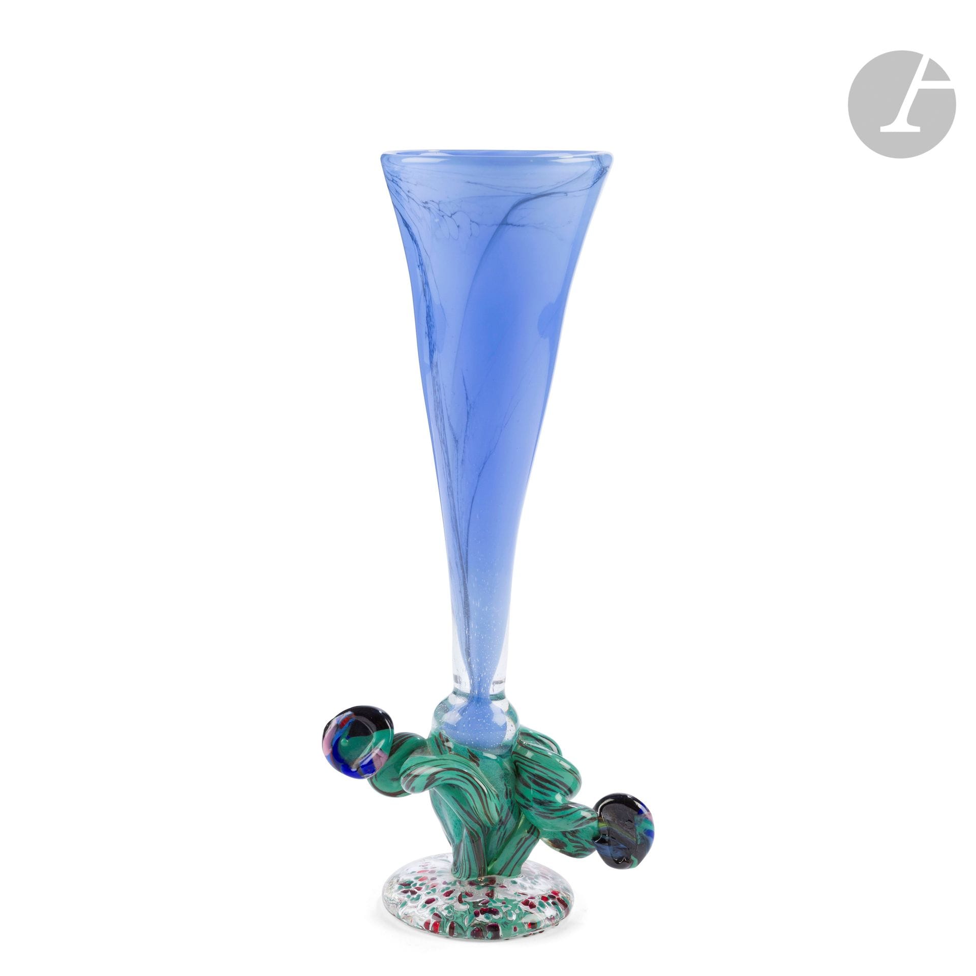 Guy UNTRAUER (France, b. 1948) 
Blue blown glass cone vase on a speckled glass base with polychrome glass cord decoration. Signed and dated 1992 on the foot. H. 28 cm - L. 12 cm

Provenance: Collection Janine Bloch-Dermant, Paris. 
