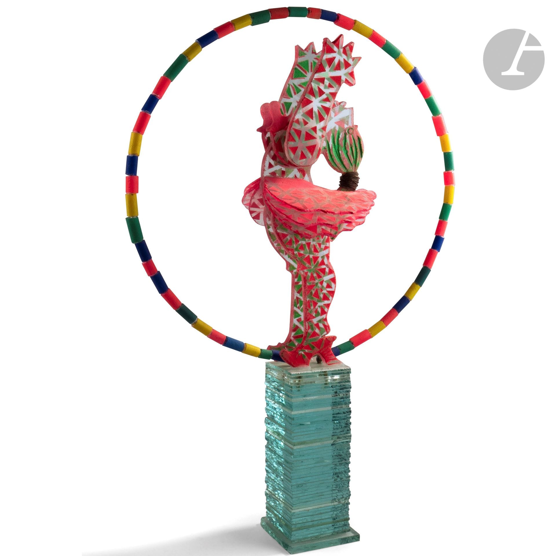 MARCOVILLE (France, né en 1939) 
Nana
Sculpture en verre taillé, sablé et peint représentant une danseuse entourée d’un cerceau de cylindre de verre sur un arc en métal, surmontant un socle de lamelles de verre. Signée en haut du socle. H. 74 cm - Socle : 11 cm de côté - D. du cerceau : 50 cm

Exposition : Sculpteur de rêves, Château de Vascœuil, 4 juillet-25 octobre 2015.