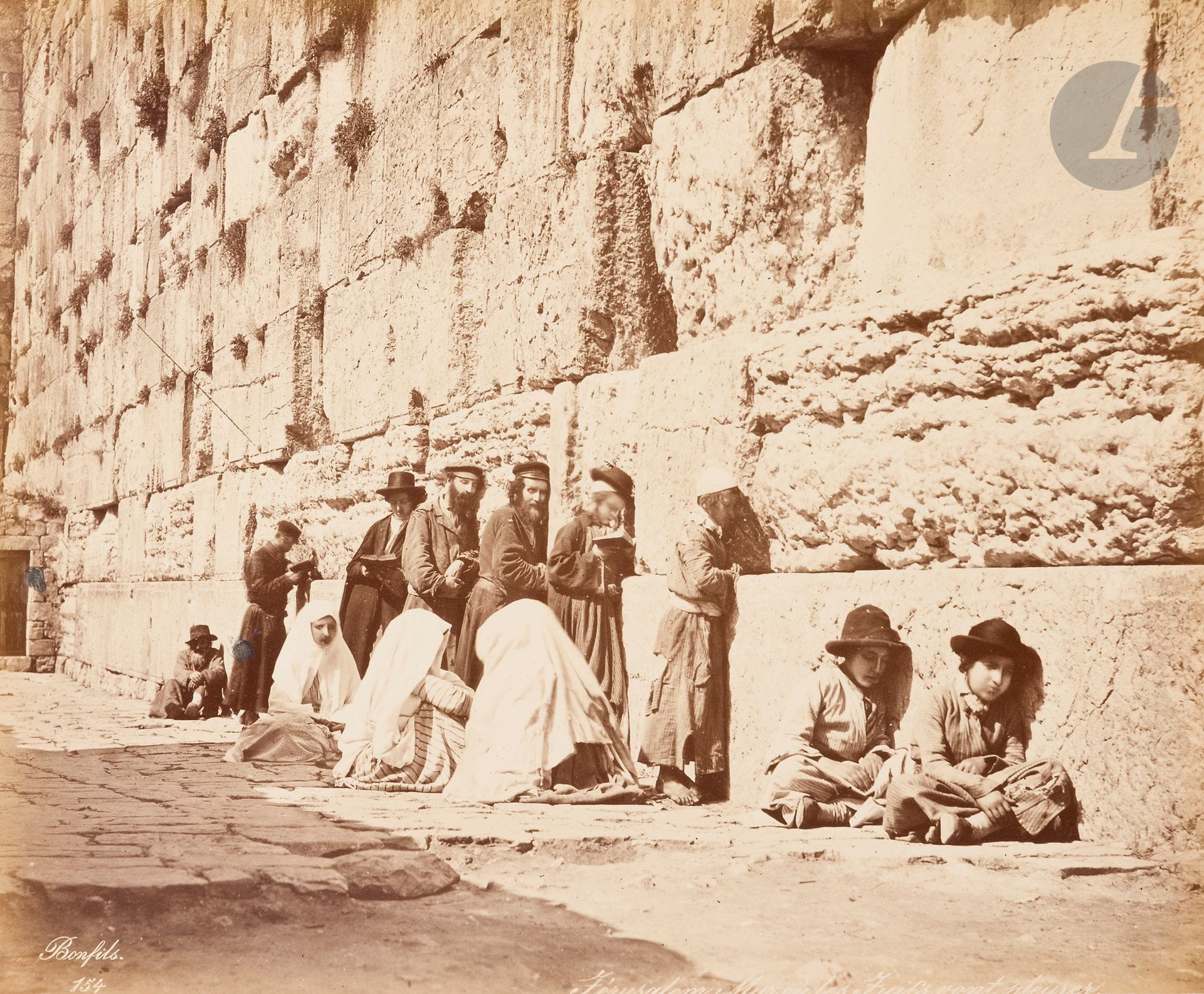 Félix Bonfils (1831-1885)
Israël. Palestine. Syrie, c. 1880.
Tombeau de St Jacques et de Zacharie. Tombeau d’Absolom. Mur où les juifs vont pleurer. Temple de Salomon. Porte de Davia. Église du Pater. Mosquée El Aqsa. Porte dorée. Jérusalem, Village de Siloé. Lieu où Saint-Étienne a été lapidé. Béthulie/Sanour. Ruines de Samarie. Damas, intérieur de la maison juive Stambouli. Damas, cour de la maison juive Stambouli. Quartier chrétien ruiné en 1860. Damas, vue générale de la cour de la grande mosquée. Porte du temple de Jupiter à Baalbek. Minaret de la Fiancée. Vue du village de Rameleh.
20 épreuves sur papier albuminé, contrecollées sur cartons. Signature du photographe et légendes en bandeau dans les négatifs en bas.
Format moyen : 22 x 27 cm
