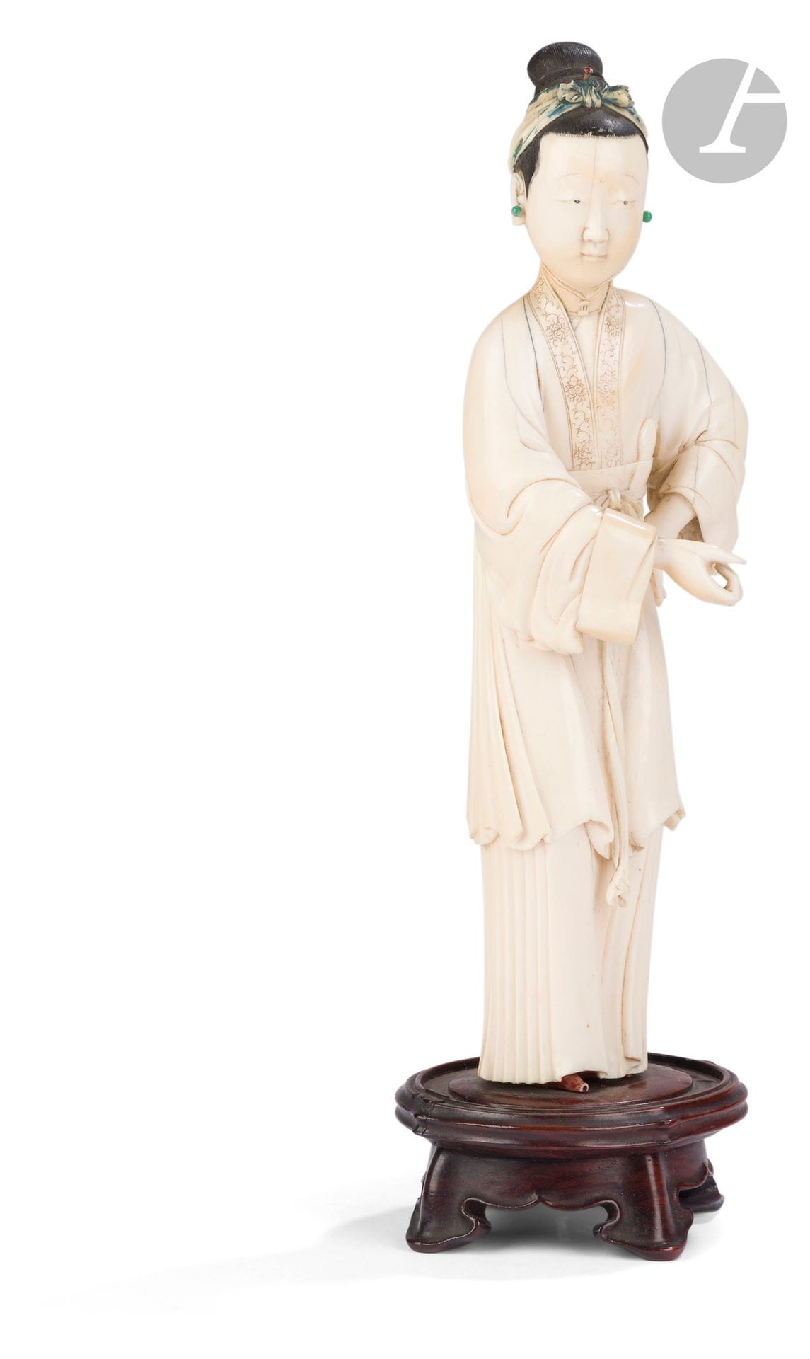 Statuette of a young woman in polychrome ivory, China, 18th century
The woman stands with one hand elegantly resting on her hip and the other extended forward. She is wearing an ample coat with a collar incised with a peony motif, over which is superimposed a skirt belted at the front by a bow. Her face is serene, and her black lacquered hair is pulled up into a bun with a blue-tinted textile tied above the forehead and a red-tinted hairpin. She wears green glass earrings. A shoe can be seen at the edge of the dress.
Height: 25 cm; gross weight: 646 g 
Mounted on a pedestal. Accents and restorations.

N°CIC : FR2307511736-K