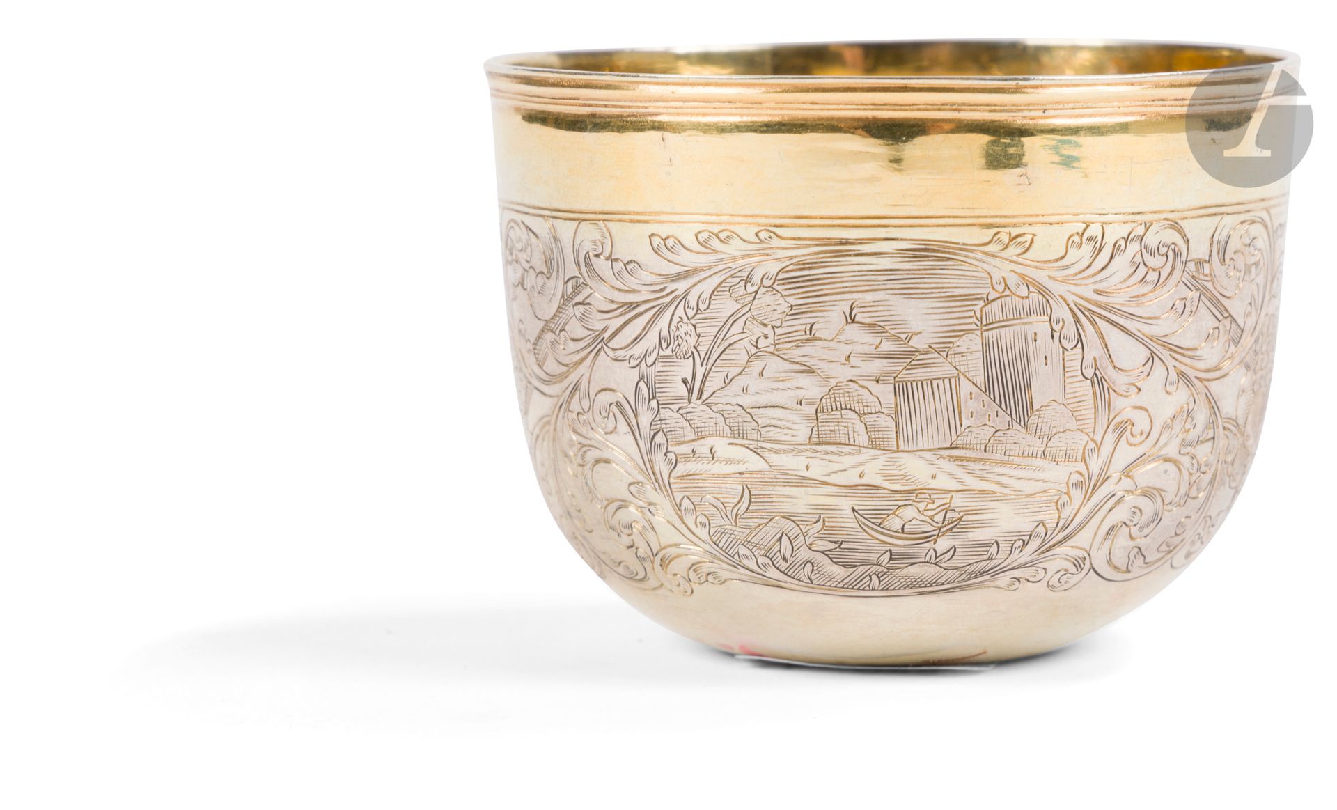 Small silver and vermeil kettledrum. Moscow, 1729-1748.
Curon with engraved decoration of landscapes in two reserves and foliage.
Hallmarks: Moscow, an eagle in a circle of dots (very partial), assayer "...R" (Afanassy Rybakov? First letter badly struck) and silversmith "ТС/Д" (Trifon Semenov Dobryakov).
Height: 5.4 cm; diameter: 7 cm; weight: 63 g