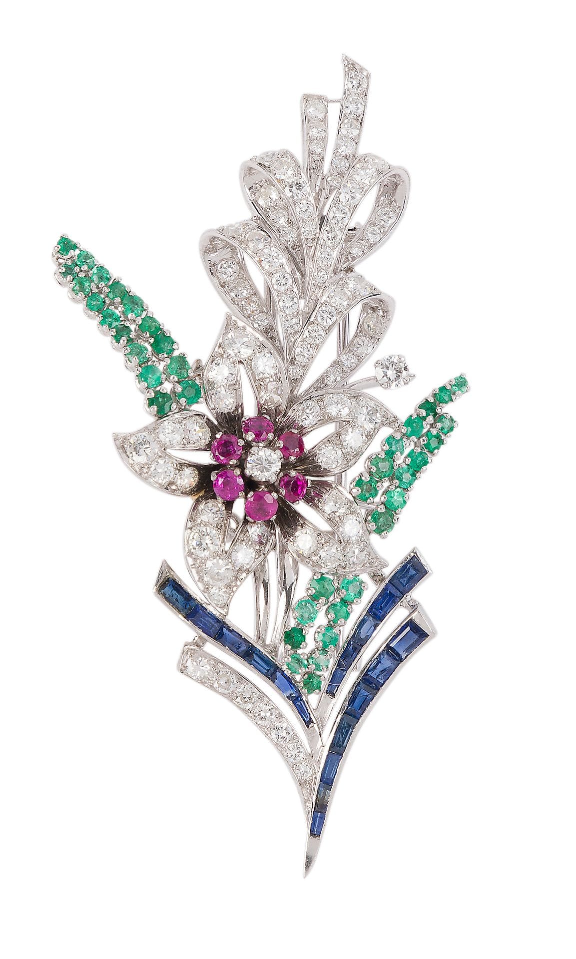 Flower brooch-clip in platinum and 18K (750) white gold, set with round brilliant-cut and 8/8-cut diamonds, the pistil highlighted with rubies, the buds in emeralds, the stems adorned with calibrated sapphires. French work from the 1960s. Height: approx. 7.8 cm. Gross weight: 26.9 g (knocks, chips)