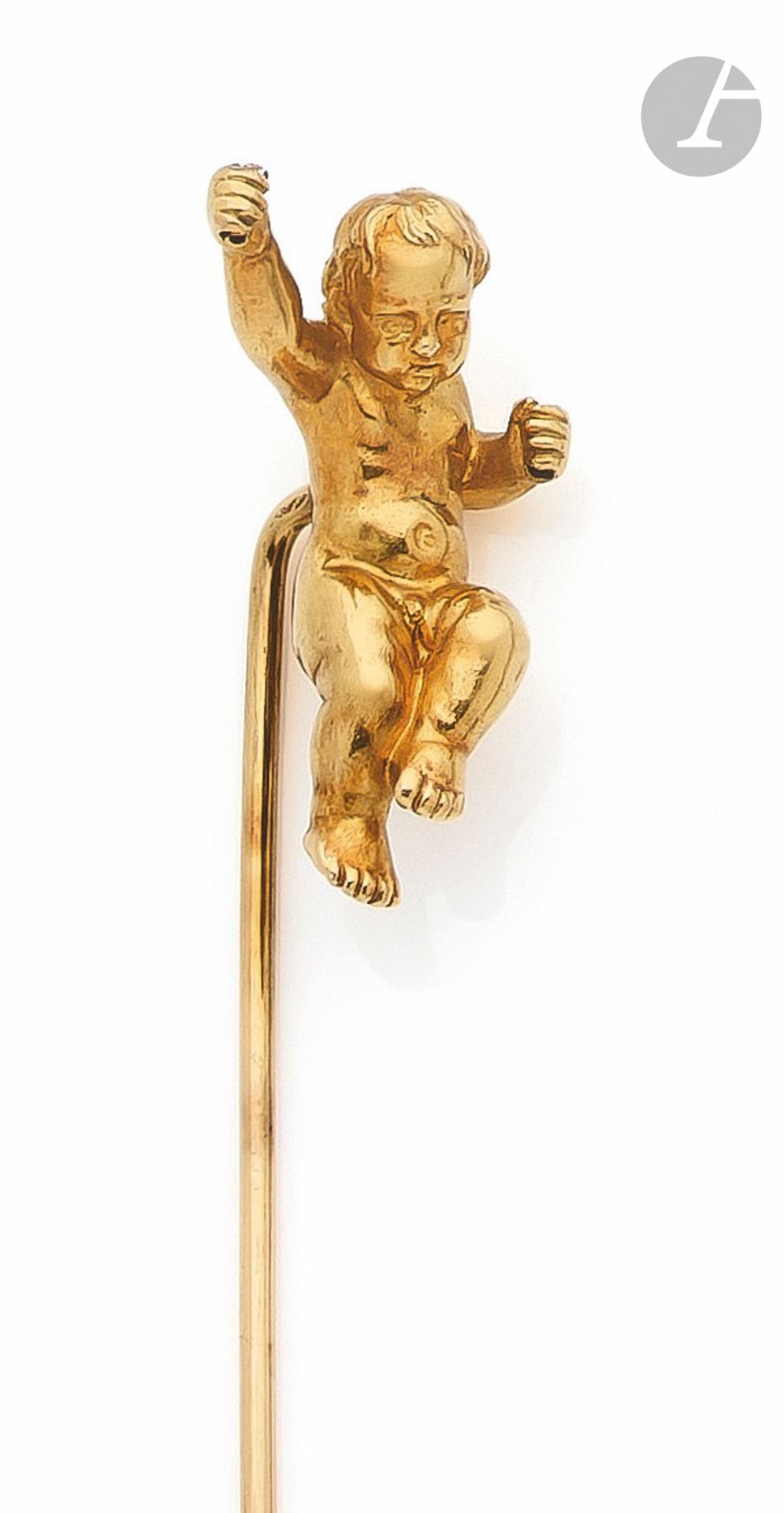Epingle de chapeau en or 18K (750), sommée d'un amour en ronde bosse. Travail français du début du XXe siècle. Hauteur du motif : 3,2 cm environ. Poids : 20,8 g

A French early 20th century Cupidon's hat pin