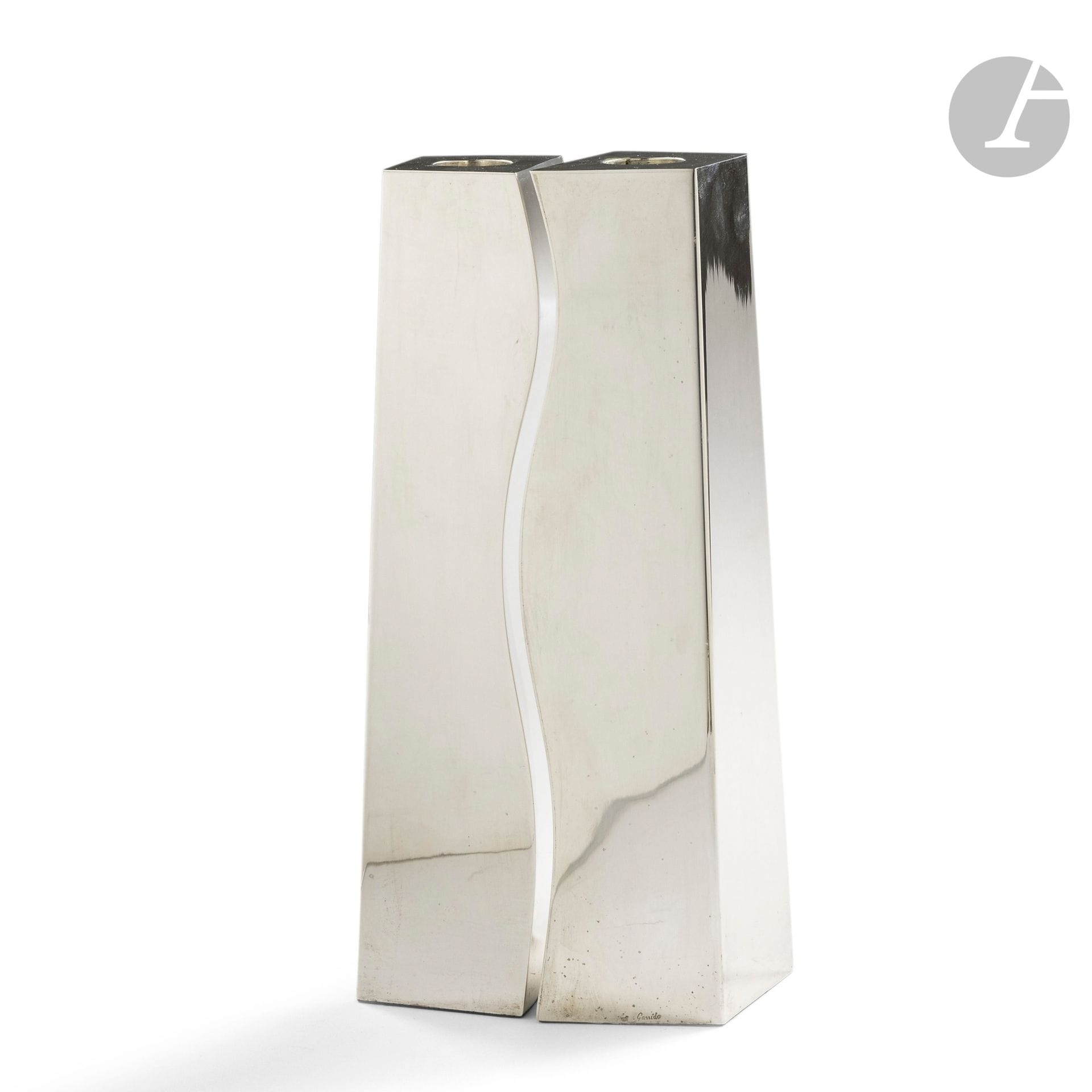JUAN &amp; PALOMA GARRIDO (B. 1965) &amp; (B. 1968) GOLDSMITHS
Olds, one of our proofs numbered 8/40
Pair of candlesticks.
Silver proofs 925/1.000.
One candlestick signed GARRIDO, hallmarked 925/1.000 and numbered 8/40 on the reverse, the other bears the title hallmark.
Height: 29.5cm
Weight: 1.982,50 g

Important:
A certificate from the Maîtres Orfèvres will be given to the purchaser.

Bibliography and related works:
Collective - Garrido orfebres (1994-2005) - Éditions Litonor, 2005. Very similar model reproduced on pages 82 and 83.