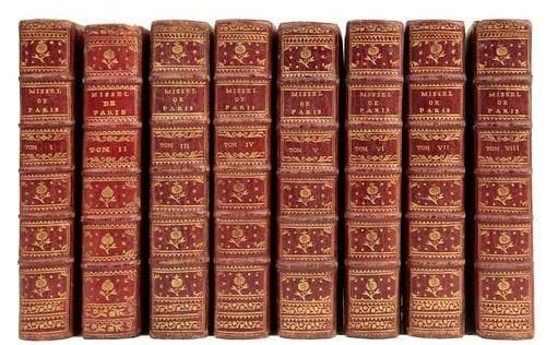 MISSEL DE PARIS, latin-françois, Avec Prime, Tierce, Sexte, et les processions, imprimé par ordre de monseigneur l'Archevêque. Paris: Les Libraires associés, 1764. - 8 volumes in-12, maroquin rouge, triple filet doré en encadrement et fleuron doré aux angles sur les plats, dos à nerfs orné, roulette dorée intérieure, tranches dorées (reliure de l'époque). Très bel exemplaire de ce missel de Paris complet de toutes ses parties, en maroquin rouge de l'époque. Le second volume provient d'un autre exemplaire et présente un décor légèrement différent. Petits trous de vers à certaines reliures, accroc à une coiffe, quelques frottements et coins légèrement émoussés. Déchirure au faux-titre du 5e volume, 4 feuillets mal placés dans le 6e volume