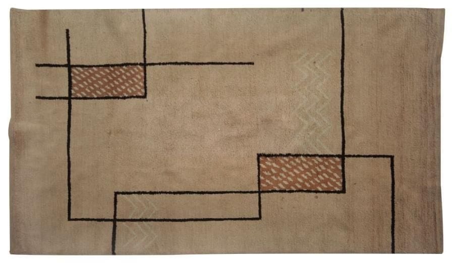 Travail des ANNÉES 1930/40
Tapis moderniste en laine au point noué.  Décor géométrique brun et beige sur fond crème.  292 x 196 cm