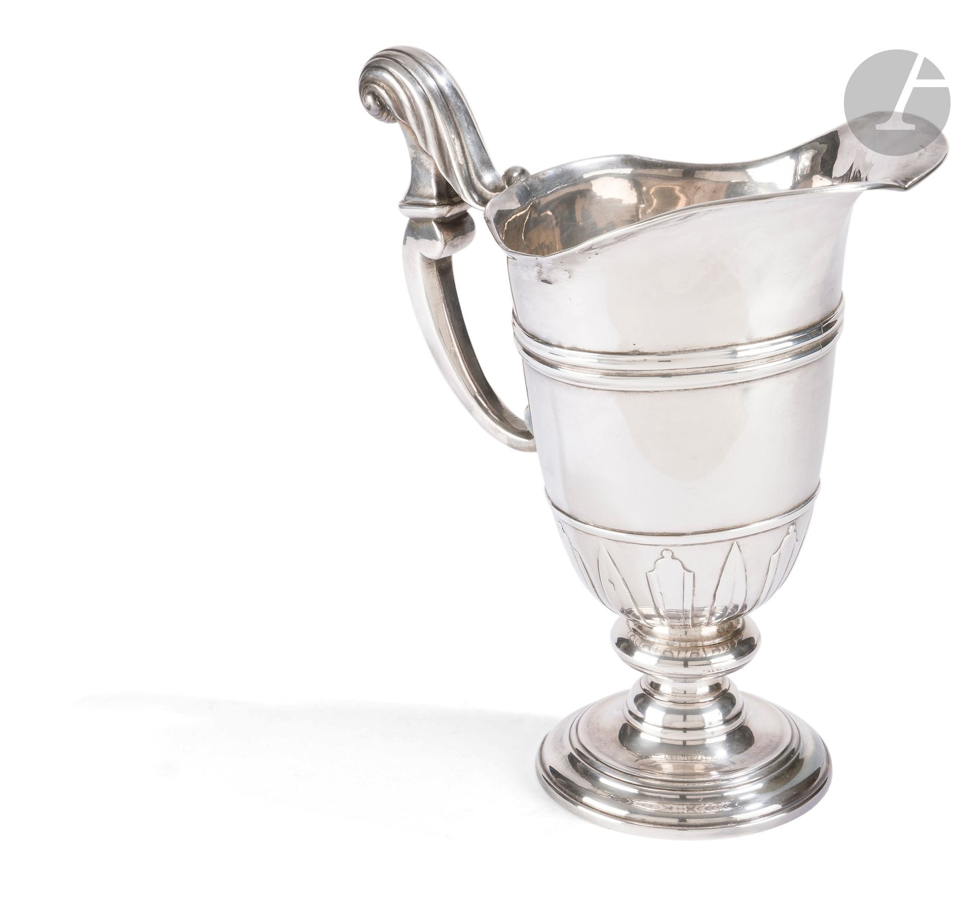 FRANCE 18th century
Formerly plated metal hanap, re-silvered, helmet model with alternating appliques, crook handle. 
Height: 26 cm
Condition: old repair, fixed pedestal.