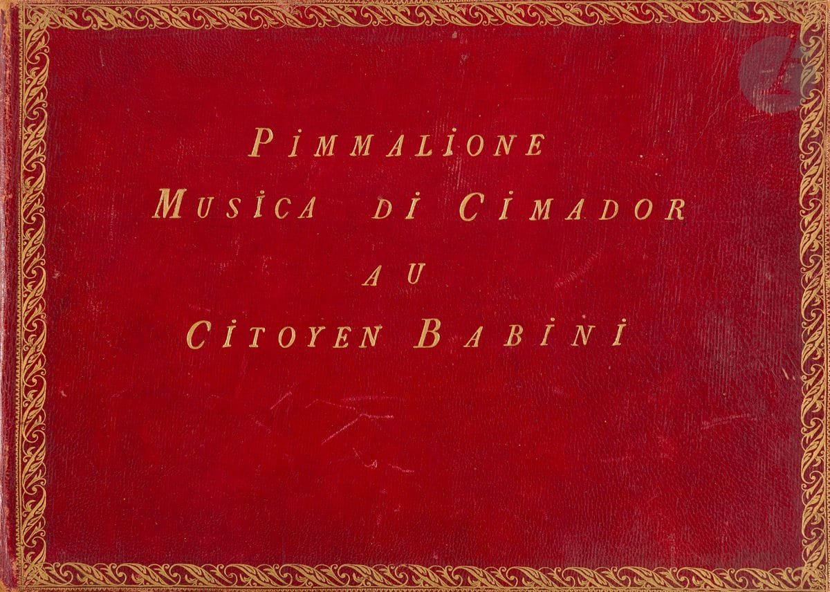 Giambattista CIMADOR (1761-1805). Manuscrit musical, Pimmalione, [Venise, 1790] ; petit in-4 oblong (21 x 29 cm), 82 ff.n.ch. de musique notée maroquin rouge à long grain, dos lisse muet orné de guirlandes et fleurons dorés, filet et large guirlande dorés encadrant les plats, titre en lettres dorées au centre du premier plat, dentelle intérieure, tranches dorées (reliure de l'époque, avec de légères éraflures).


 Intéressant manuscrit de travail de cette scène lyrique, exemplaire du ténor Matteo Babini.
 Cette scène lyrique pour ténor et orchestre, s'achevant sur un bref duo final avec Galatea, créée le 26 janvier 1790 au Teatro San Samuele de Venise, est composée sur un livret d'Antonio Sografi (1759-1818), d'après le Pygmalion de Jean-Jacques Rousseau (1762), inspiré d'un fameux épisode des Métamorphoses d'Ovide. Le livret de Sografi sera adapté pour le Pigmalione de Donizetti, son premier opéra (1816). 
 Ce manuscrit de travail de la partition d'orchestre, très lisible, présente des passages biffés et des corrections.
 L'œuvre n'a pas été publiée. Deux autres copies, dont une faite pour Pasquale Caracciolo, marquis d'Arena, " dilettante ", sont conservées à la Biblioteca del Conservatorio di musica S. Pietro a Majella de Naples ; le protagoniste y est nommé " Pigmalione ".
 Cimador fut d'abord un virtuose du violon et du violoncelle avant de composer des concerts et des pièces dramatiques interprétées à Venise, comme notre opus. En 1791, il émigra à Londres, y rencontra Haydn et y termina sa carrière.
 Cet exemplaire a appartenu Matteo BABINI (1754-1816), un des plus grands ténors italiens de la fin du XVIIIe siècle, avec son nom poussé en lettres dorées au centre du plat sup. de la reliure sous le titre : " Au Citoyen Babini ". La mention de " Citoyen " suggère une reliure un peu postérieure à la composition de l'œuvre (Babini séjourna à Paris de 1787 à 1789, puis en 1792, et c'est probablement de cette époque que date la reliure).