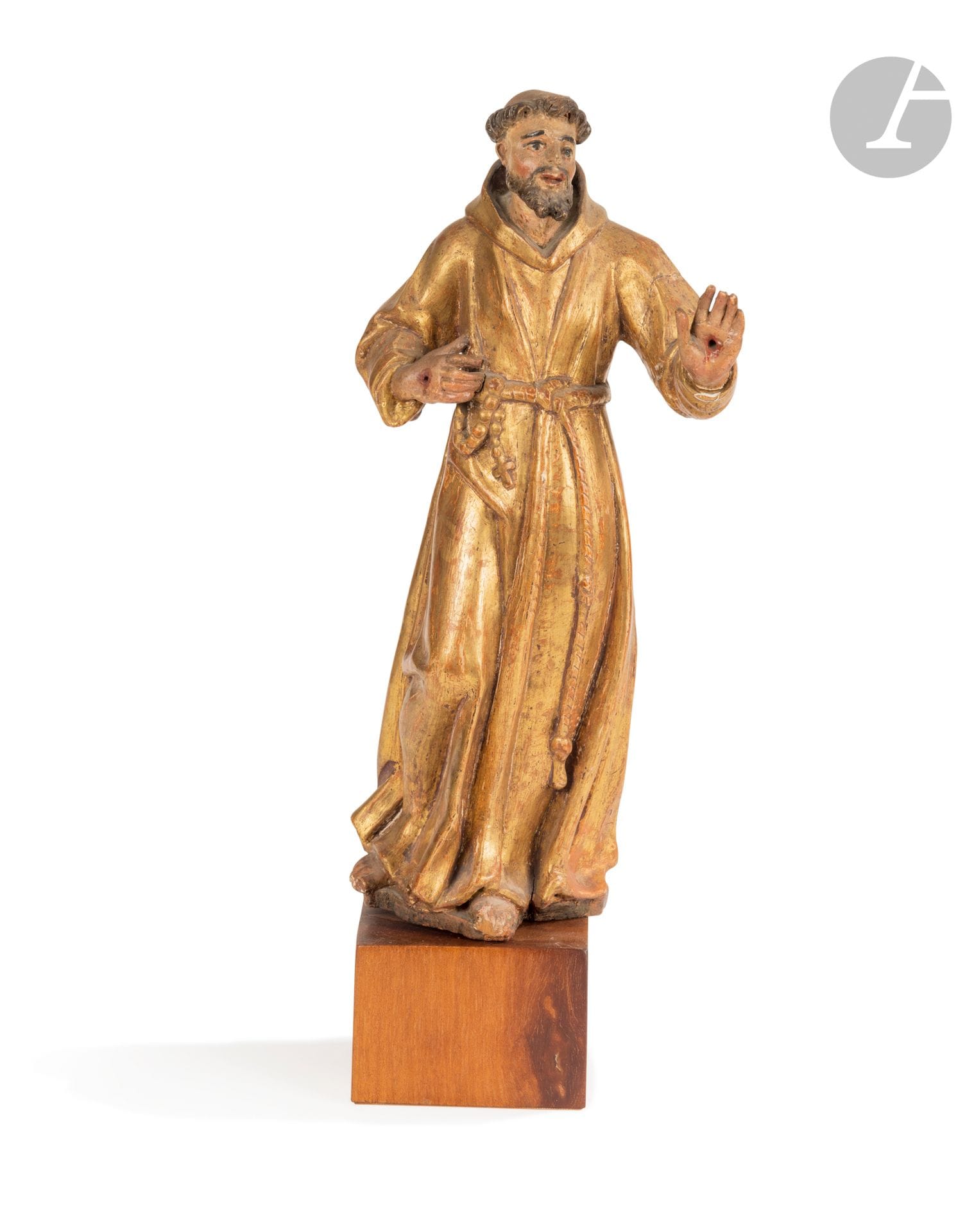 Saint François d'Assise en bois sculpté en ronde-bosse, polychromé et doré ; porte les stigmates sur sa main droite.
Espagne, XVIIe siècle
H. : 33,5 cm
(petits accidents notamment à la main gauche)