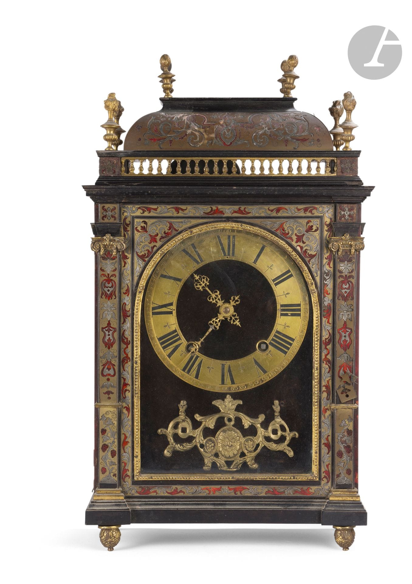 Cartel in red tortoiseshell marquetry, brass and engraved pewter, the dial with Roman and Arabic numerals, the dome with balusters and fire pots; (accidents and missing parts).
The movement signed Baronneau in Paris.
Regency period.
H : 58 cm, W : 31.5 cm, D : 14 cm