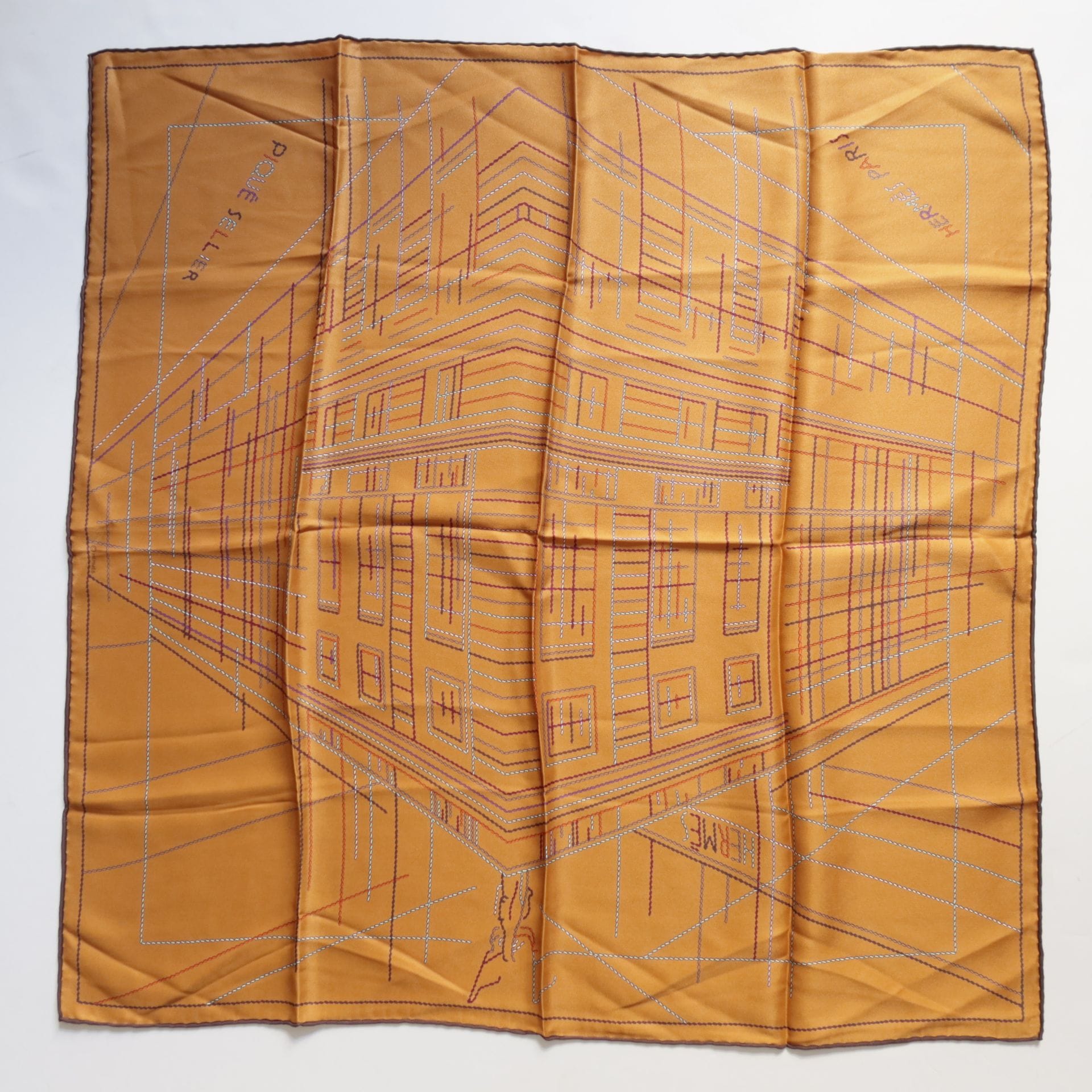 HERMÈS Paris
70 cm square in "Piqué sellier" silk twill, ochre background